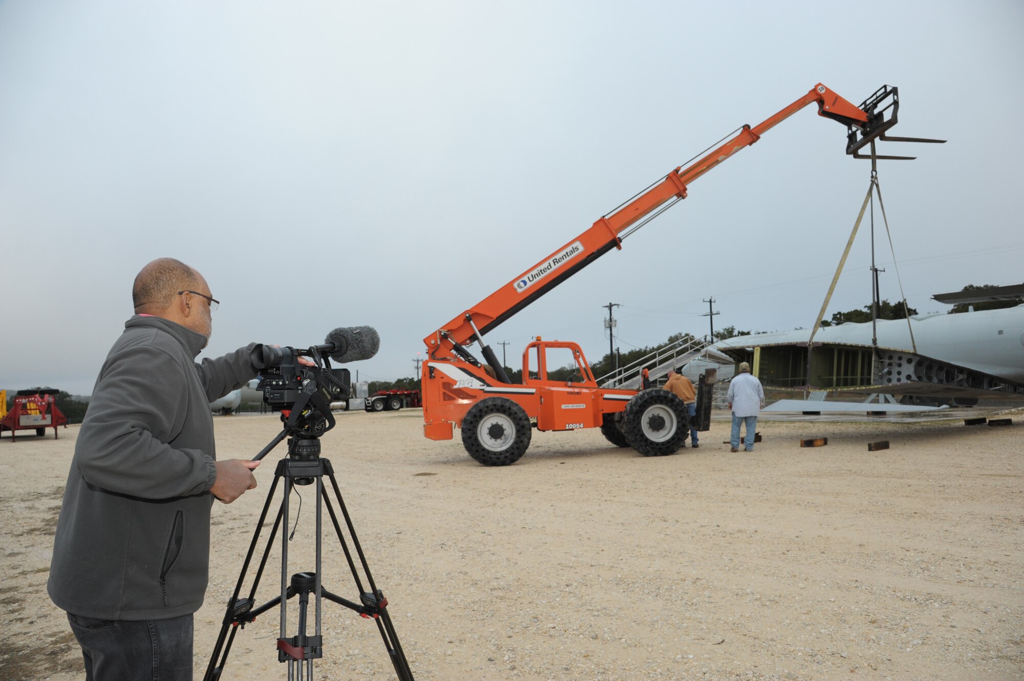 Tony Hearst, Joint Base San Antonio-Randolph videographer, documents the reassembly of a  C-130 at JBSA-Camp Bullis. The 502nd Air Base Wing Video team produces about 30 videos each quarter.  (U.S. Air Force photo by Joel Martinez)


