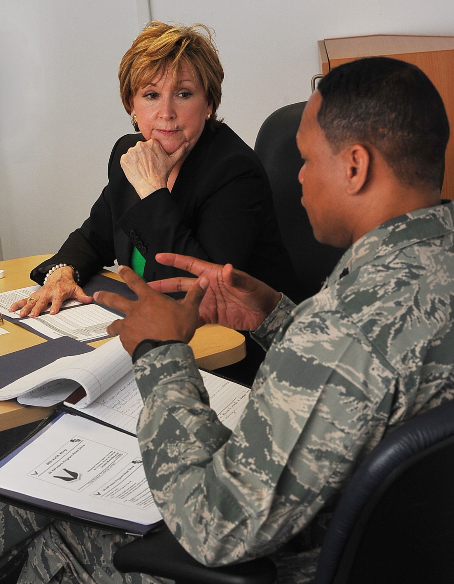 Dr. Susan Kelly, Transition to Veterans Program Office director and Lt. Col. Keithen Washington, 86th Force Support Squadron commander, visits with education center representatives March 17, 2014 at Ramstein Air Base, Germany. Kelly discussed advancing the Transition Assistance Program here and across the Department of Defense. (U.S. Air Force photo/Airman Dymekre Allen)