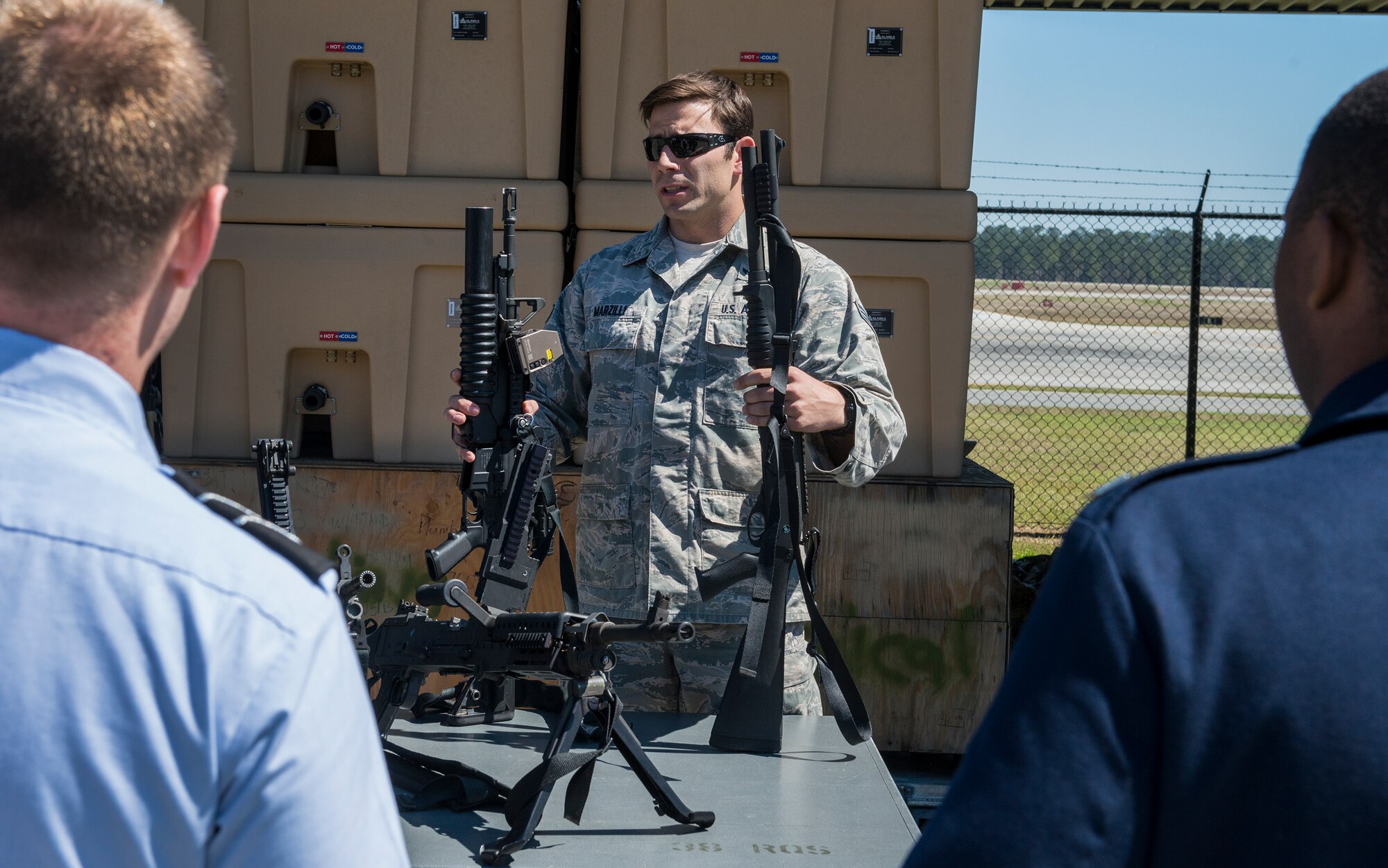 U.S. Senior Airman Anthony Marzilli, 38th Rescue Squadron pararescueman, shows weapons to U.S. Air Force Reserve Officer Training Corps cadets at Moody Air Force Base, Ga., March 14, 2014. Marzilli showed many of the weapons and tools that pararescuemen are trained to use. (U.S. Air Force photo by Senior Airman Douglas Ellis/Released)  
