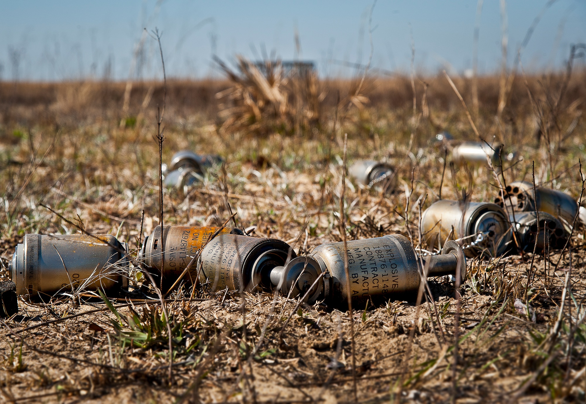 A group of FIM-92 Stinger ejection motors lie on the ground on the Eglin Air Force Base range March 14.  The ejection motor pushes the missile a safe distance from the operator before the missile blasts away toward the target. Stinger Based Systems, a division of the Army’s cruise missile defense system unit, test-fired more than 30 Stingers at aerial and fixed targets on the base’s range throughout the week.  (U.S. Air Force photo/Samuel King Jr.)