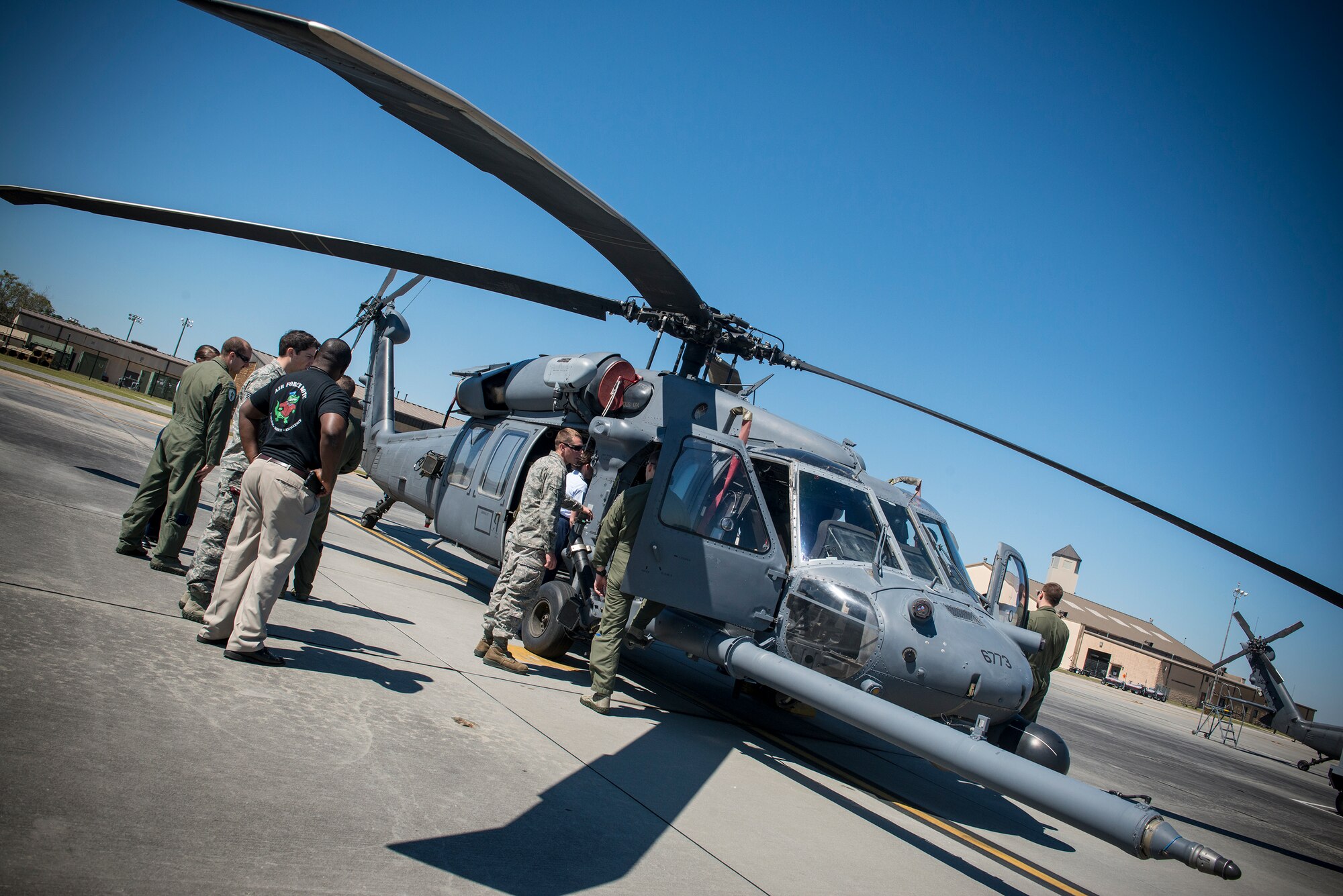 U.S. Air Force Reserve Officer Training Corps cadets from the University of Florida take a closer look inside an HH-60G Pave Hawk during a tour at Moody Air Force Base Ga., March 14, 2014. During the tour, the cadets conversed with many of Moody’s officers to learn about their job. (U.S. Air Force photo by Senior Airman Douglas Ellis/Released)

