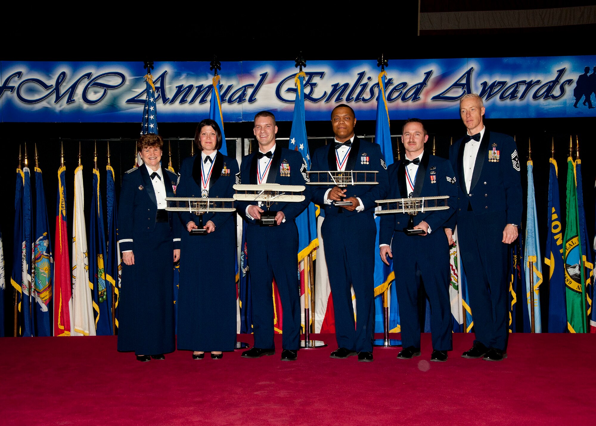 Air Force Materiel Command's Annual Enlisted Award winners for 2013 stand on stage at the ceremony. From left: Gen. Janet Wolfenbarger, AFMC commander; Master Sgt. Christienne Ruth, Wright-Patterson Air Force Base, Ohio; Senior Master Sgt. Michael Venning, Wright-Patterson AFB; Staff Sgt. David Phillips, Wright-Patterson AFB; Senior Airman Robert Hile, Wright-Patterson AFB; and Chief Master Sgt. Michael Warner, AFMC command chief. (U.S. Air Force photo/Michelle Gigante)