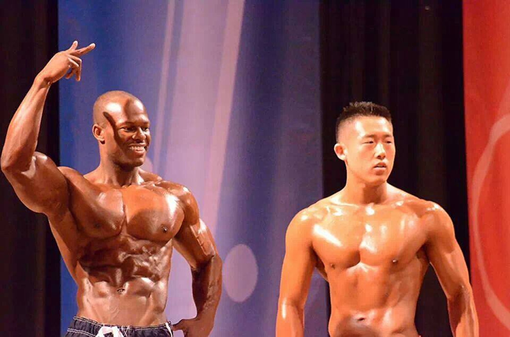 Tech. Sgt. Robert Niter III, left, 47th Medical Group NCO in charge of optometry, and Airman 1st Class Samuel Hahn, right, 47th MDG Public Health technician, pose during a Musclemania competition in San Antonio, Texas, March 1, 2014. Hahn won second place in Men’s Physic, while Niter was awarded first in Men’s Model and Men’s Physic. (Contributed photo/Wayne Perry)