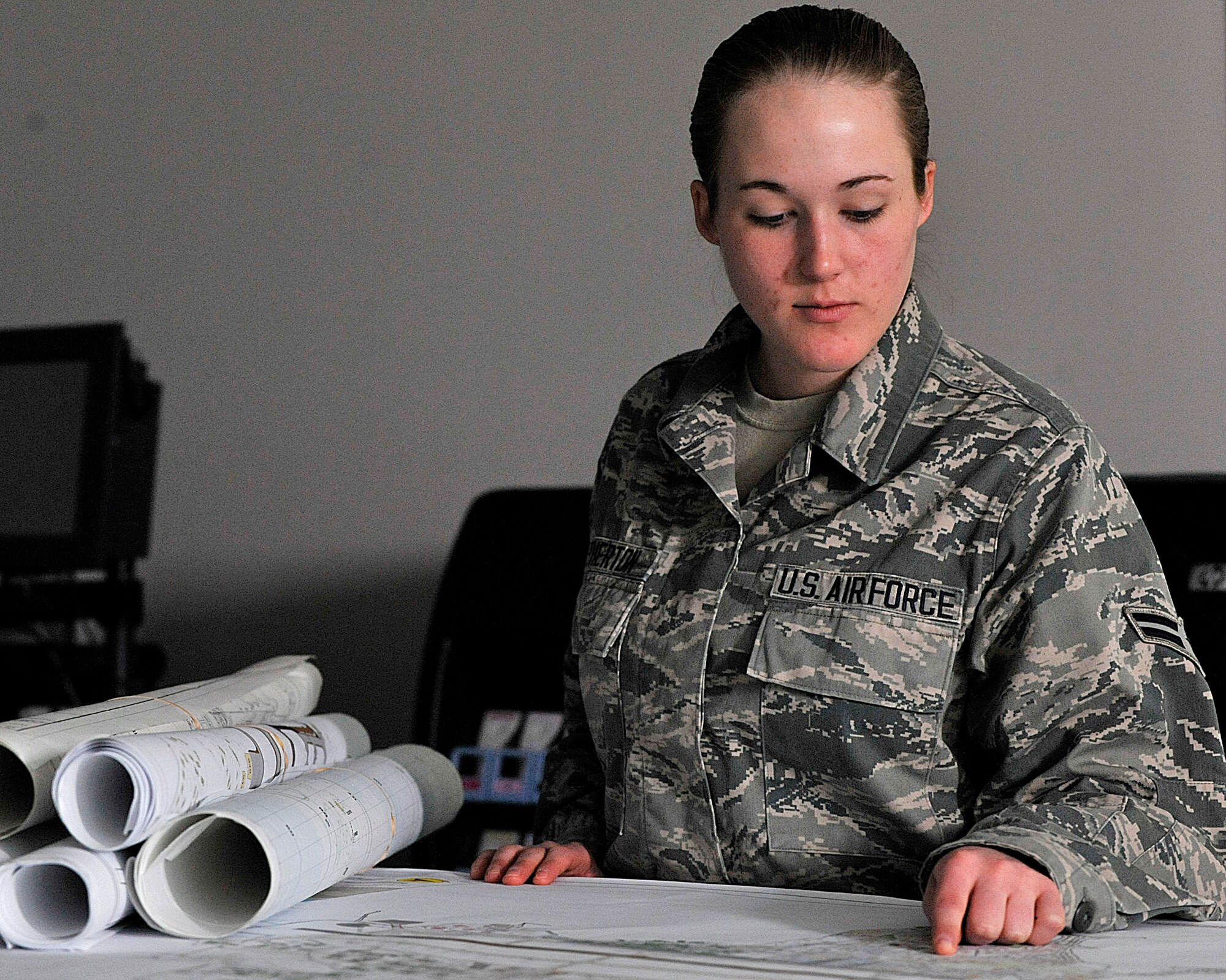 MISAWA AIR BASE, Japan -- U.S. Air Force Airman 1st Class Kherra Etherton, 35th Civil Engineer Squadron engineering apprentice, is the Wild Weasel of the Week at Misawa Air Base, Japan, March 18, 2014. Etherton surveys and plots new construction locations to keep track of the work being performed, and use as references for future projects. (U.S. Air Force photo/ Staff Sgt. Tong Duong)