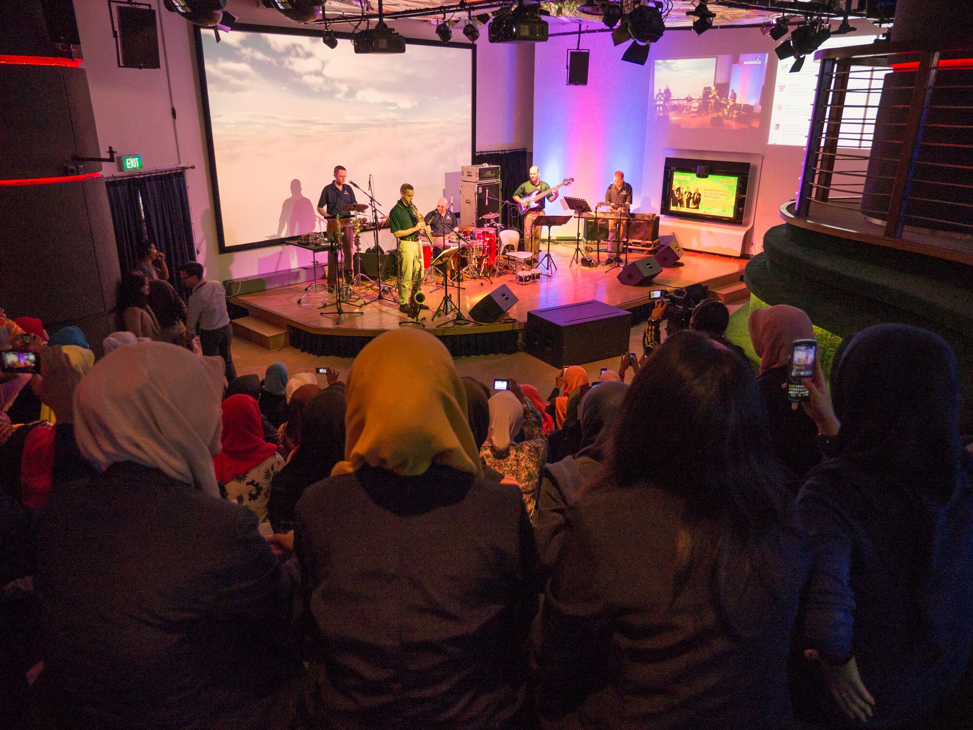 JAKARTA, Indonesia -- Pacific Clave', Band of the Pacific-Asia world-music ensemble, delivers a live-streamed performance for a group of college students at @America, Pacific Place Mall, Jakarta, Indonesia on Mar. 4, 2014. Indonesian students come to @America for discussions, web chats, cultural performances, and exhibitions and advice and assistance for educational placement in the U.S.; @America has approximately 35,000 Facebook followers. (U.S. Air Force photo by Staff Sgt. Josh Voyles)