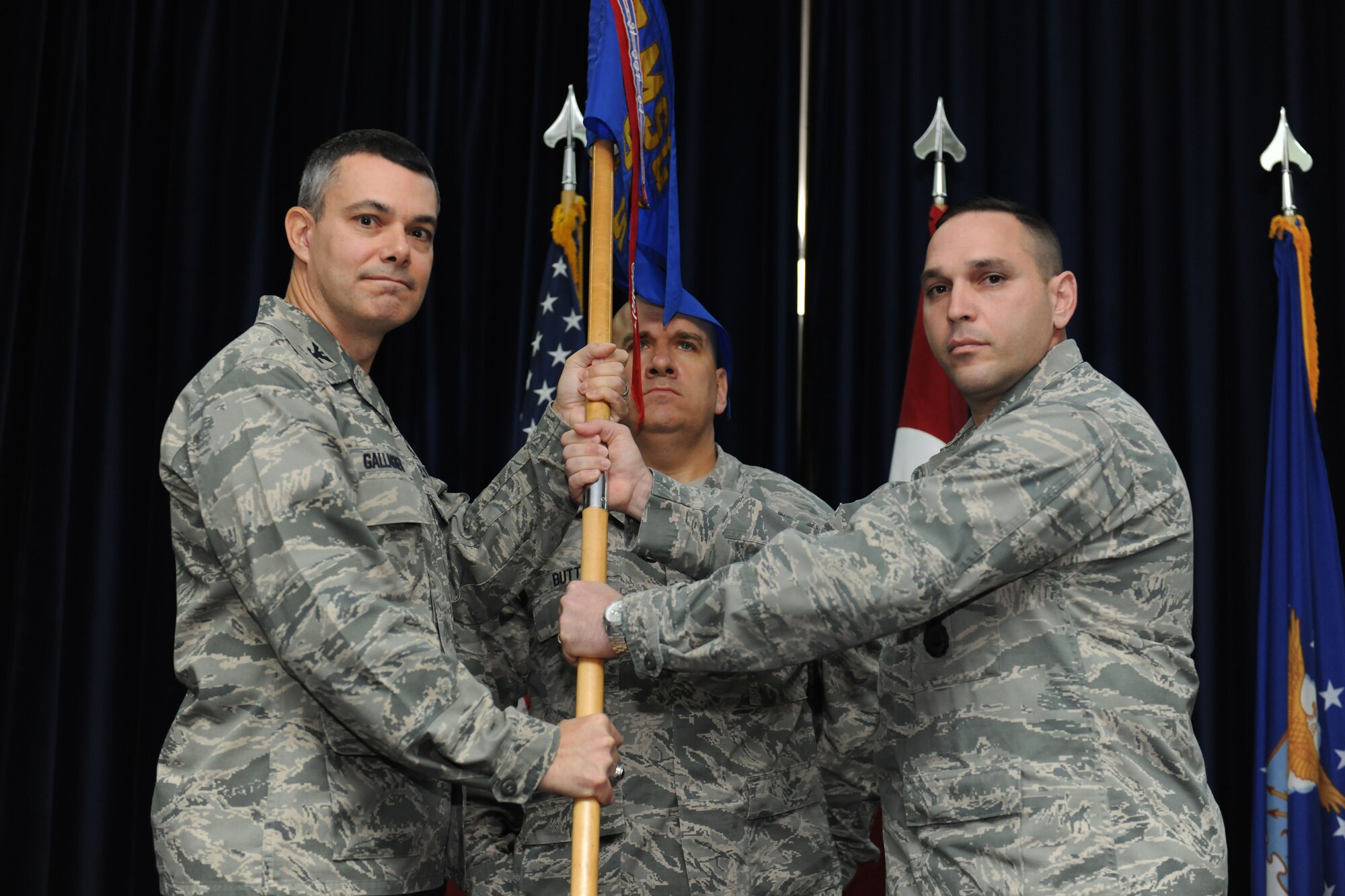 Lt. Col. Joseph Musacchia, incoming 39th Security Forces Squadron commander, receives the guidon from Col. Sean Gallagher, 39th Mission Support Group commander, during the 39th SFS change of command ceremony March17, 2014, Incirlik Air Base, Turkey. The passing of the guidon symbolized the transfer of authority and responsibility from Lt. Col. Lee Curoe to Musacchia.   (U.S. Air Force photo by Senior Airman Nicole Sikorski/Released)
