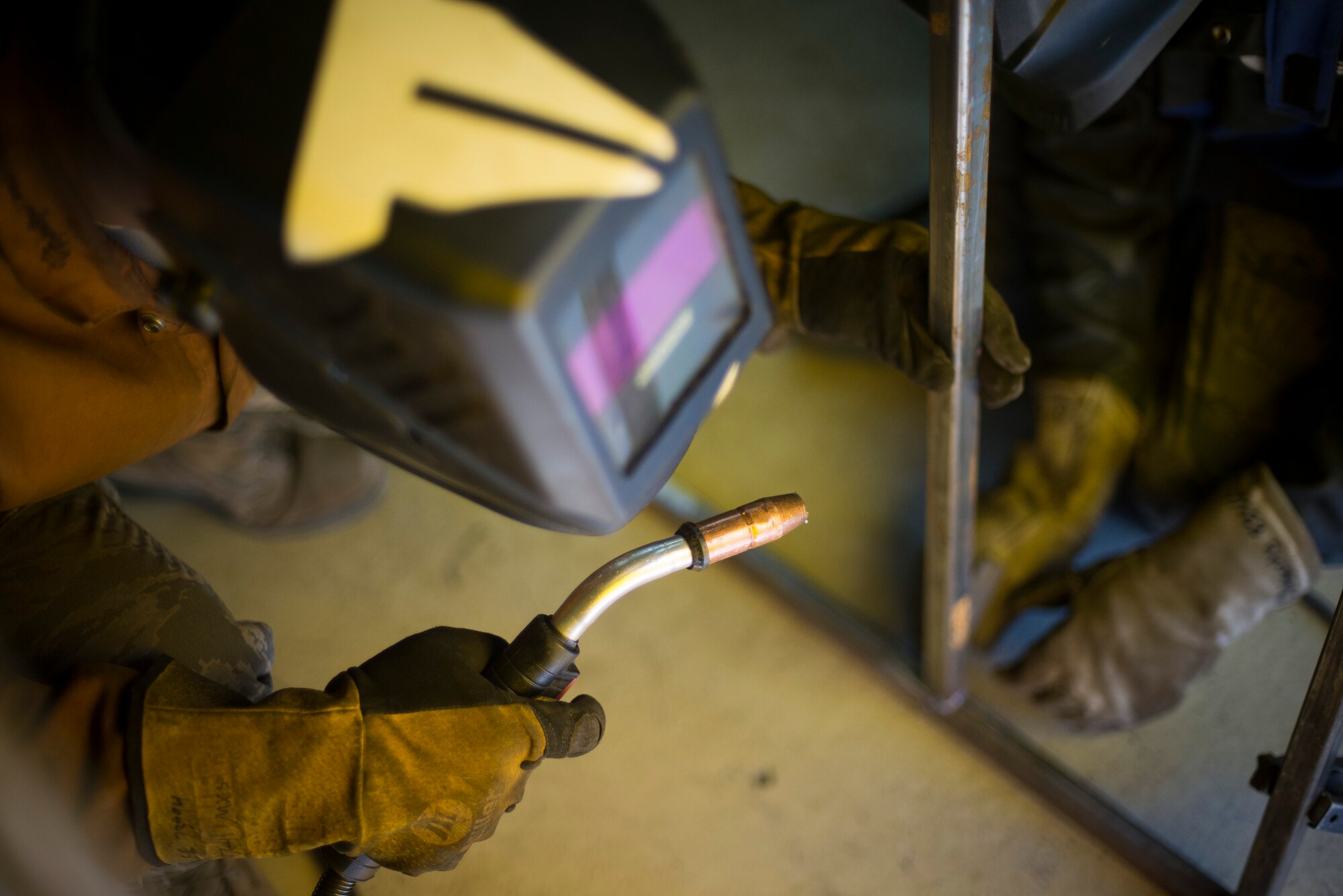 Airman 1st Class Jake Kohler, 374th Maintenance Squadron aircraft metals technology specialist, aligns a section of a metal rack at Yokota Air Base, Japan, Mar. 18, 2014. (U.S. Air Force photo by Staff Sgt. Chad C. Strohmeyer/Released)