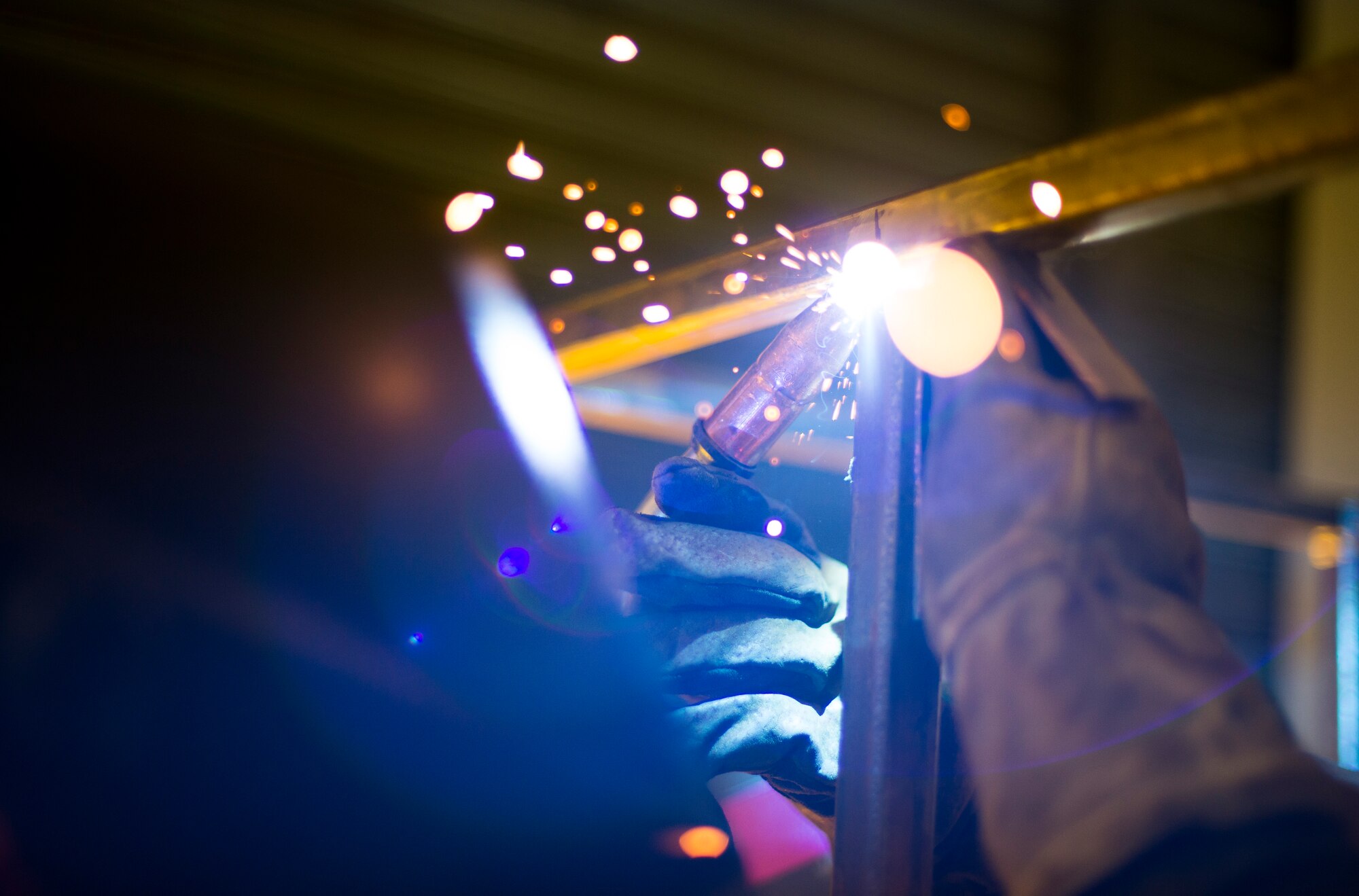 Airman 1st Class Curtis Doherty, 374th Maintenance Squadron aircraft metals technology specialist, welds a section of a metal rack at Yokota Air Base, Japan, Mar. 18, 2014. The rack will be used to store and maintain unused metal, which will increase safety and productivity. (U.S. Air Force photo by Staff Sgt. Chad C. Strohmeyer/Released)