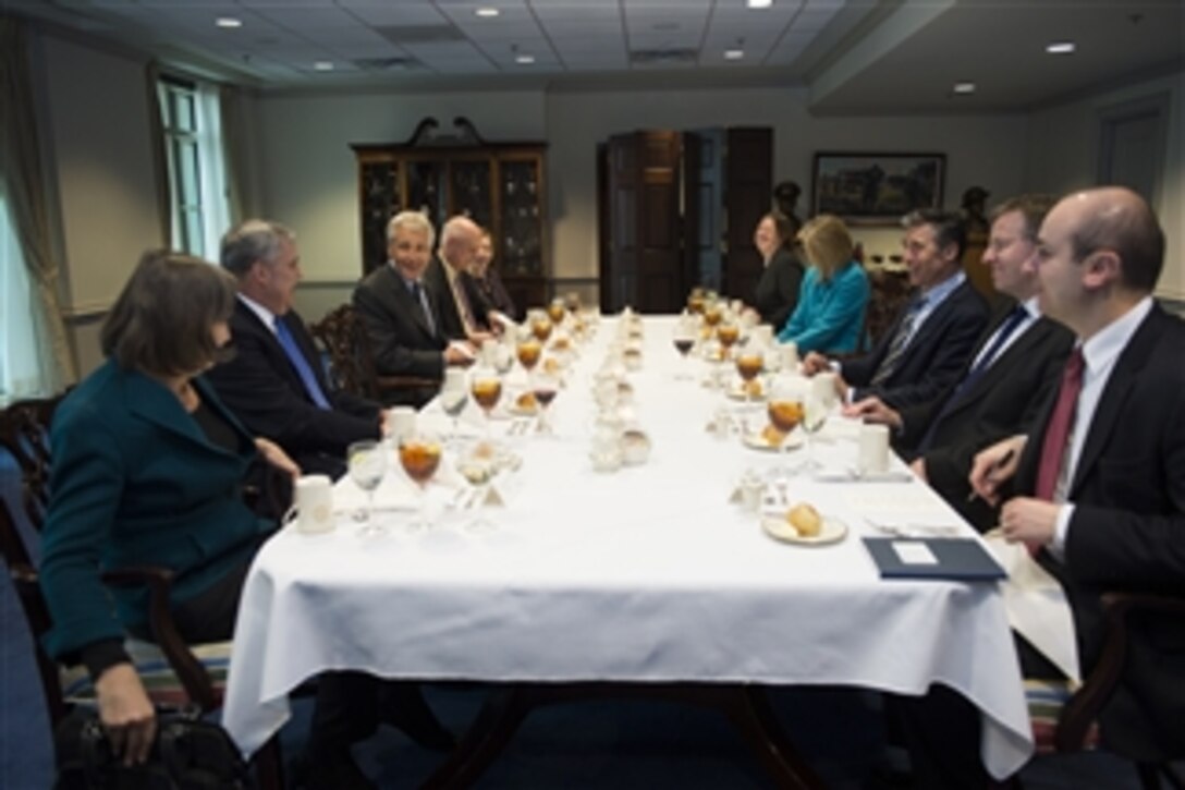 U.S. Defense Secretary Chuck Hagel, third from left, hosts a dinner for NATO Secretary General Anders Fogh Rasmussen, third from right, at the Pentagon, March 18, 2014. The leaders met to discuss issues of mutual concern.