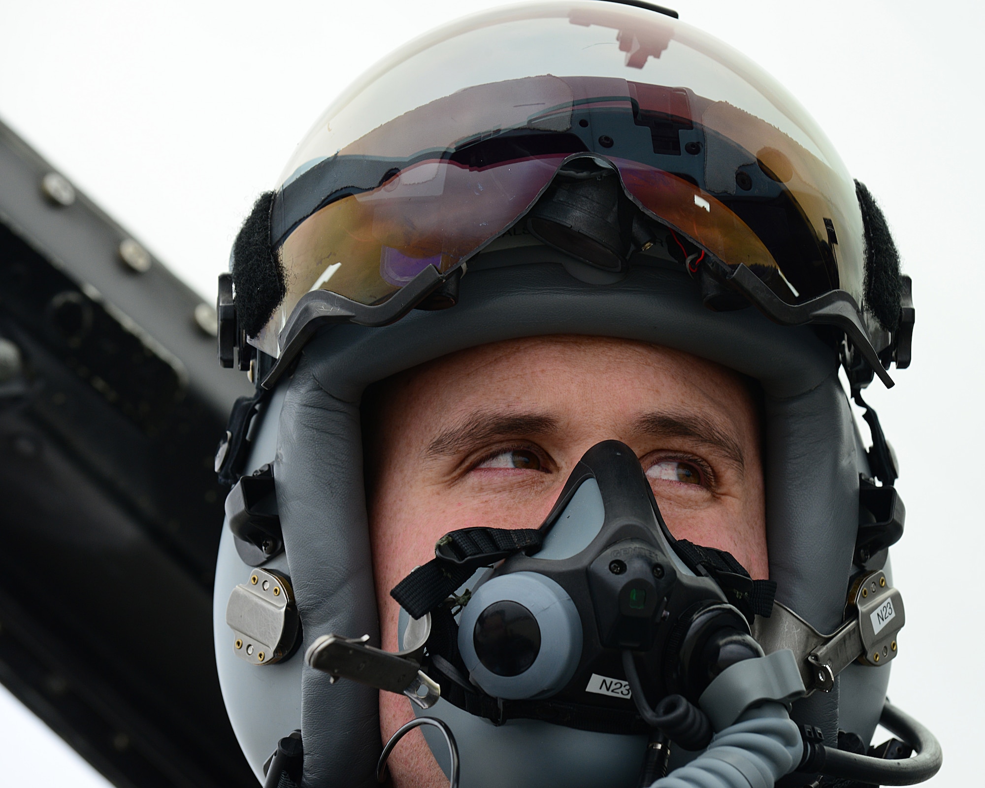 First Lieutenant Matthew Alexander straps on his MBU-20/P oxygen mask before a training flight mission, March 18, 2014, at Lask Air Base, Poland. The aerial training exercises a pilot’s ability to operate across a range of military operations with precise full-spectrum capabilities. Alexander is a 555th Fighter Squadron pilot. (U.S. Air Force photo/Airman 1st Class Ryan Conroy) 

