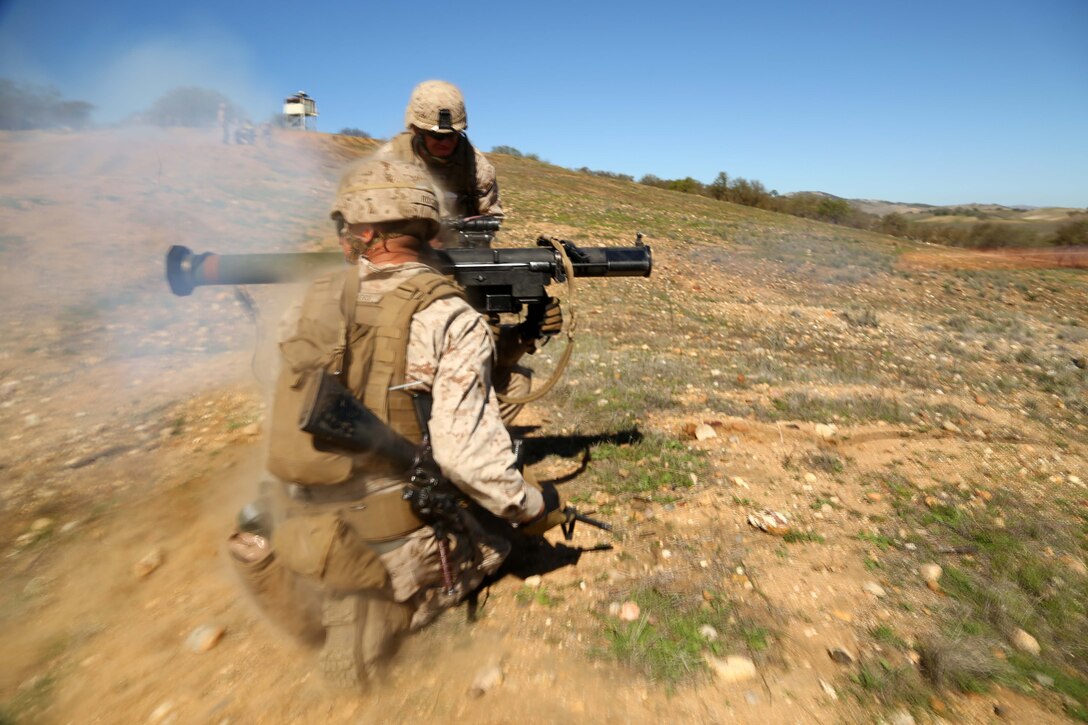 Marines with 2nd Battalion, 1st Marines (2nd Bn 1st Mar), 11th Marine Expeditionary Unit, fire a Shoulder-launched Multipurpose Assault Weapon (SMAW) as part of a live-fire training exercise during Realistic Urban Training Marine Expeditionary Unit Exercise 14-1 (RUTMEUEX) at Camp Roberts, Calif., March 18, 2014.  RUTMEUEX will prepare the 11th MEU Marines for their upcoming deployment, enhancing their combat skills in environments similar to those they may find in future missions.  (U.S. Marine Corps photo by Lance Cpl. Laura Y. Raga/Released)