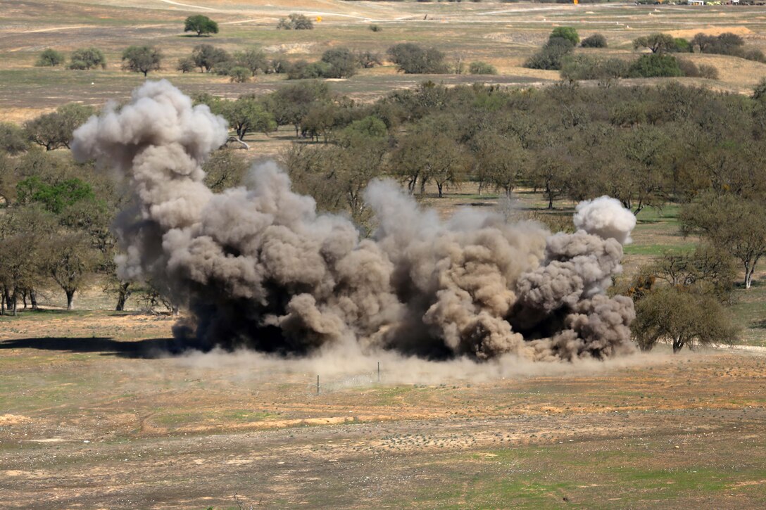 Marines with 2nd Battalion, 1st Marines (2nd Bn 1st Mar), 11th Marine Expeditionary Unit, discharge an Anti-Personnel Obstacle Breaching System as part of a live-fire training exercise during Realistic Urban Training Marine Expeditionary Unit Exercise 14-1 (RUTMEUEX) at Camp Roberts, Calif., March 18, 2014.  RUTMEUEX will prepare the 11th MEU Marines for their upcoming deployment, enhancing Marines' combat skills in environments similar to those they may find in future missions.  (U.S. Marine Corps photo by Lance Cpl. Laura Y. Raga/Released)