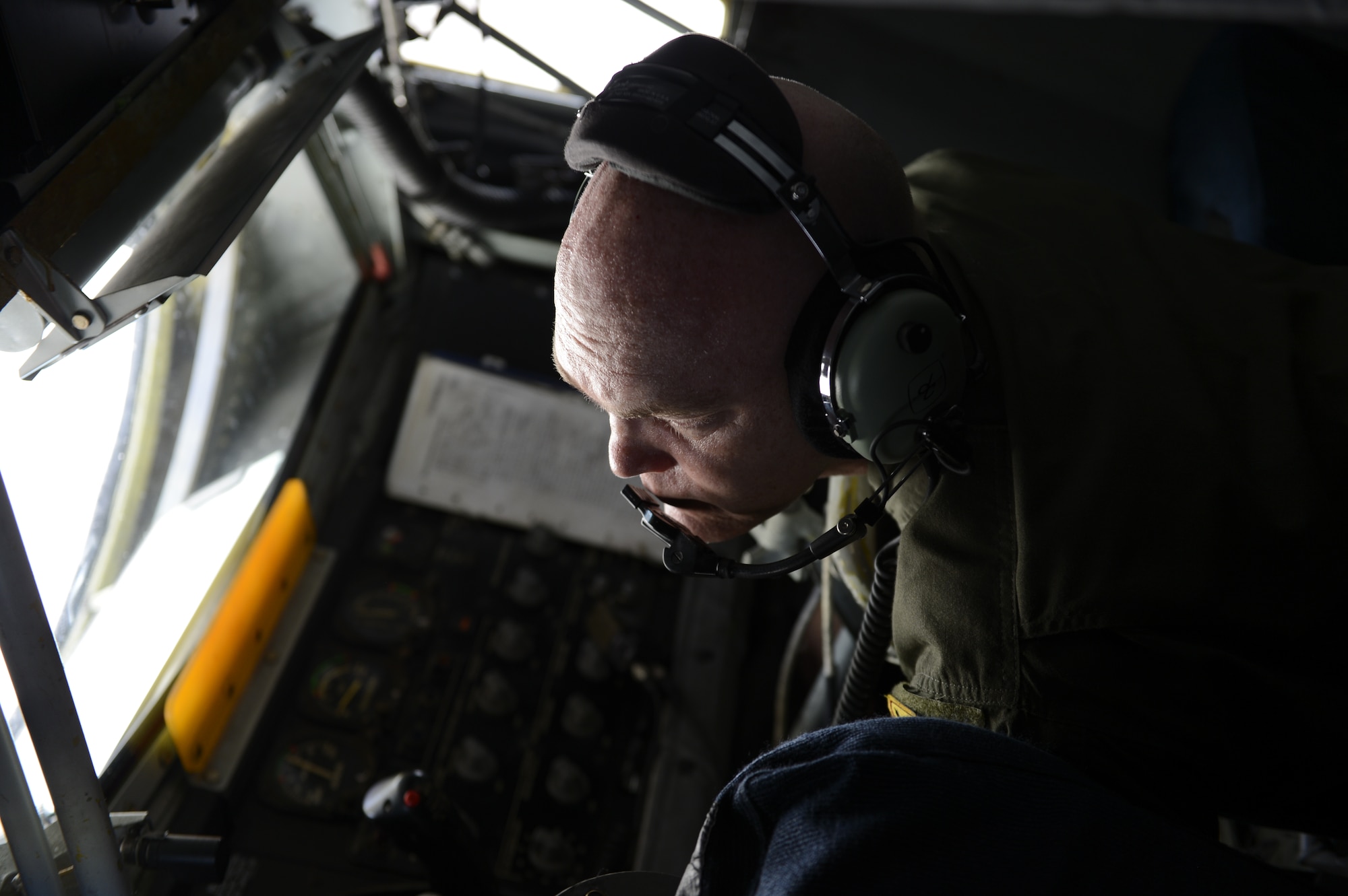 Senior Master Sgt. Brad Wolfe, 909th Air Refueling Squadron boom operator, does a pre-flight check of the fuel boom on a KC-135 Stratotanker prior to a flight in support of exercise Cope North 2014, Andersen Air Force Base, Guam, Feb. 25, 2014. During this event, the aviators train on war-fighting integration tactics. Cope North is a multilateral aerial and humanitarian assistance and disaster relief exercise, held annually, designed to increase the combat readiness and interoperability of the U.S. Air Force, Japanese Air Self Defense Force, and Royal Australian Air Force.  (U.S. Air Force photo by Tech. Sgt. Henry Hoegen)