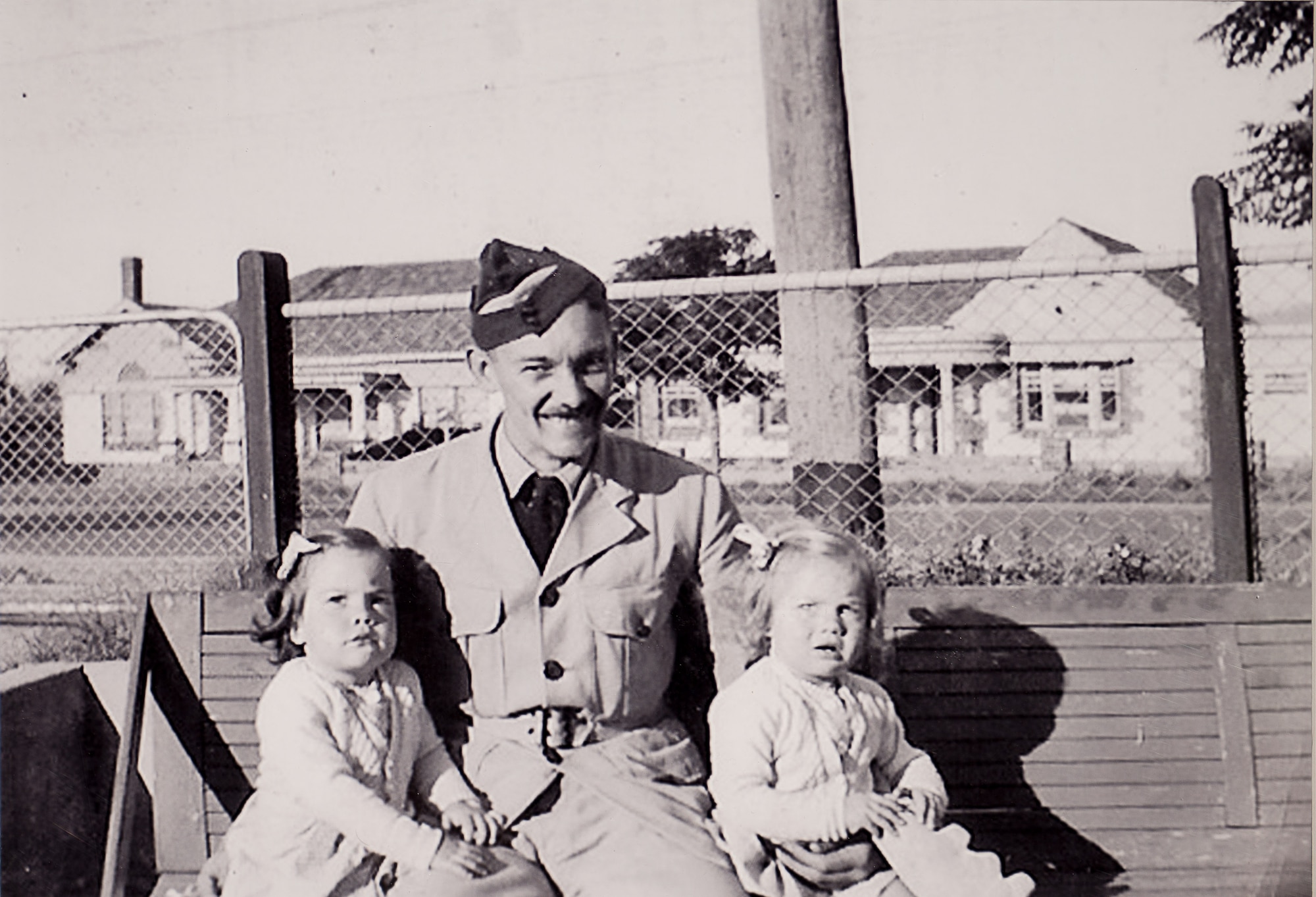 Royal Australian Air Force Flying Officer Edward Thompson Mobsby poses with his 18-month-old twin daughters, Jennifer and Rae. Mobsby was the co-pilot of a B-52 aircraft shot down by the enemy during a mission over Papua New Guinea in 1942. Mobsby was posthumously awarded the Silver Star Medal at a ceremony in Canberra, Australia, March 14, 2014. (Photo courtesy of the U.S. Embassy in Canberra)