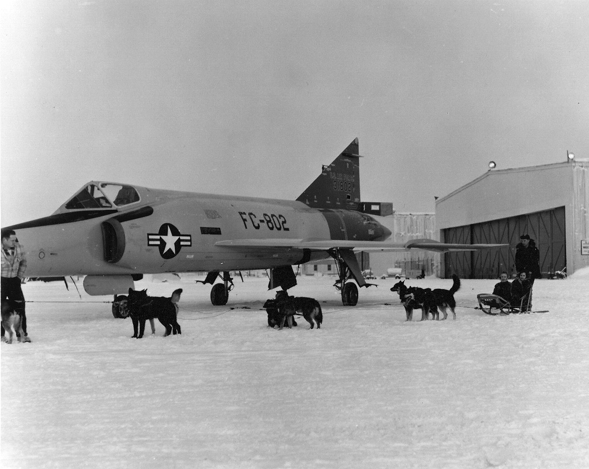 A team of sled dogs stand beside a Convair F-106 Delta Dart circa 1960 at Ladd Air Force Base, Alaska. (Photo courtesy of Fort Wainwright archives)