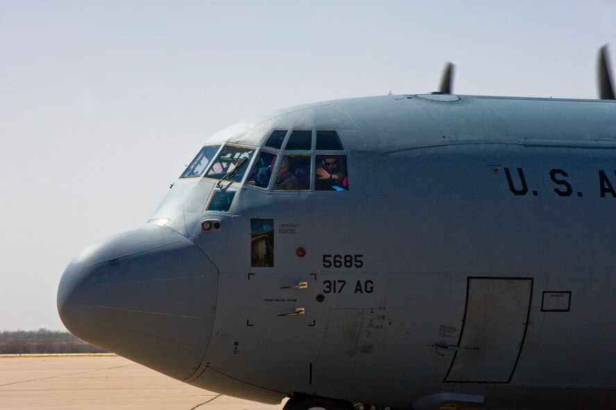 A C-130J from 317th Airlift Group arrives back from a deployment March 18, 2014, at Dyess Air Force, Texas. Dyess has the largest fleet of C-130Js and this deployment marked the first all C-130 J-model deployment for the 317th. (U.S. Air Force photo by Airman 1st Class Alexander Guerrero/Released)