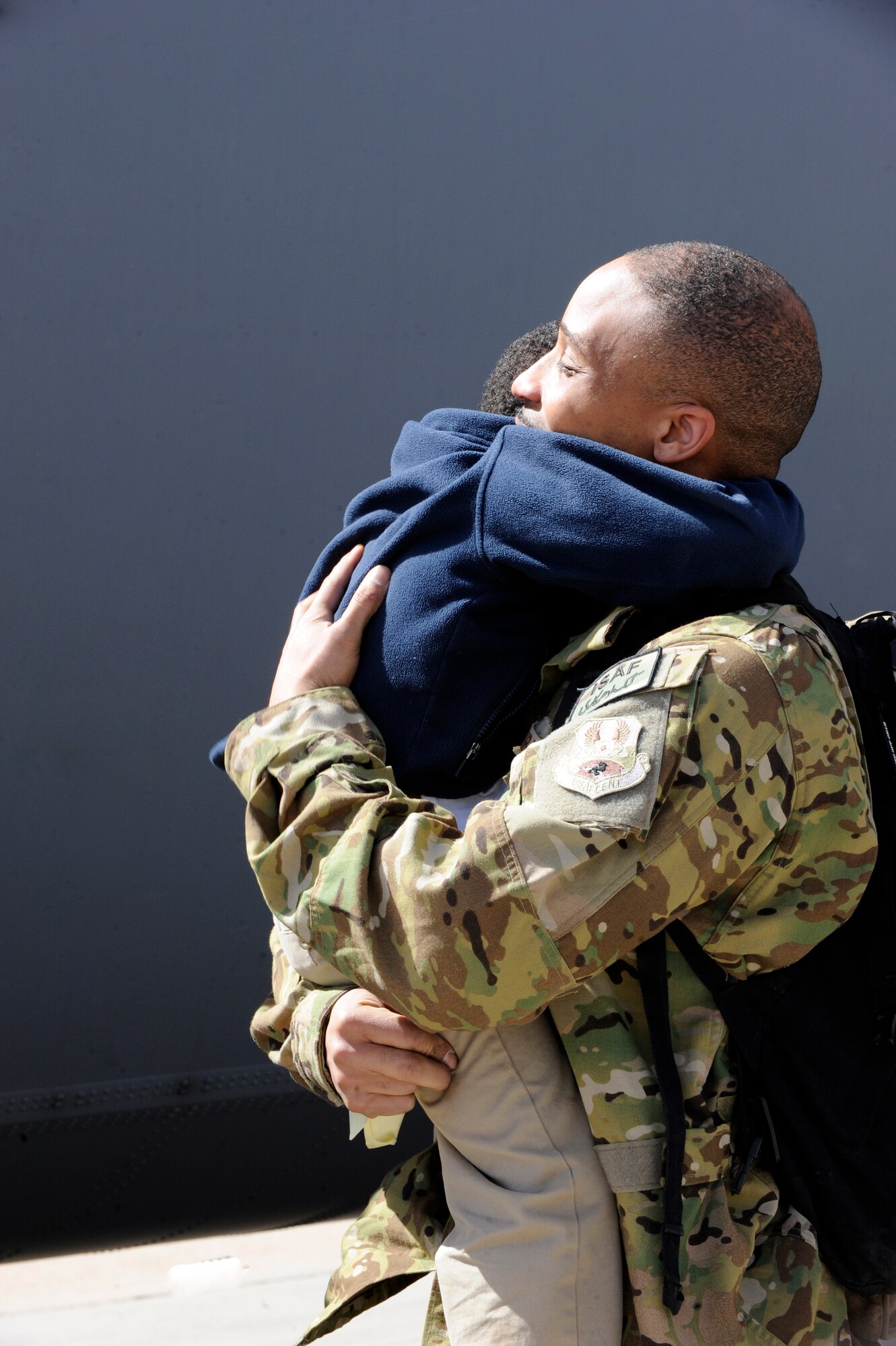 U.S. Air Force Master Sgt. Robert Furbush, 39th Airlift Squadron, hugs his son after his return from a six month deployment March 18, 2014, at Dyess Air Force Base, Texas. The 39th AS mission is to maintain quality aircrews and aircraft to mobilize deploy and provide in theater airlift worldwide for the Department of Defense. (U.S. Air Force photo by Airman 1st Class Alexander Guerrero/Released)