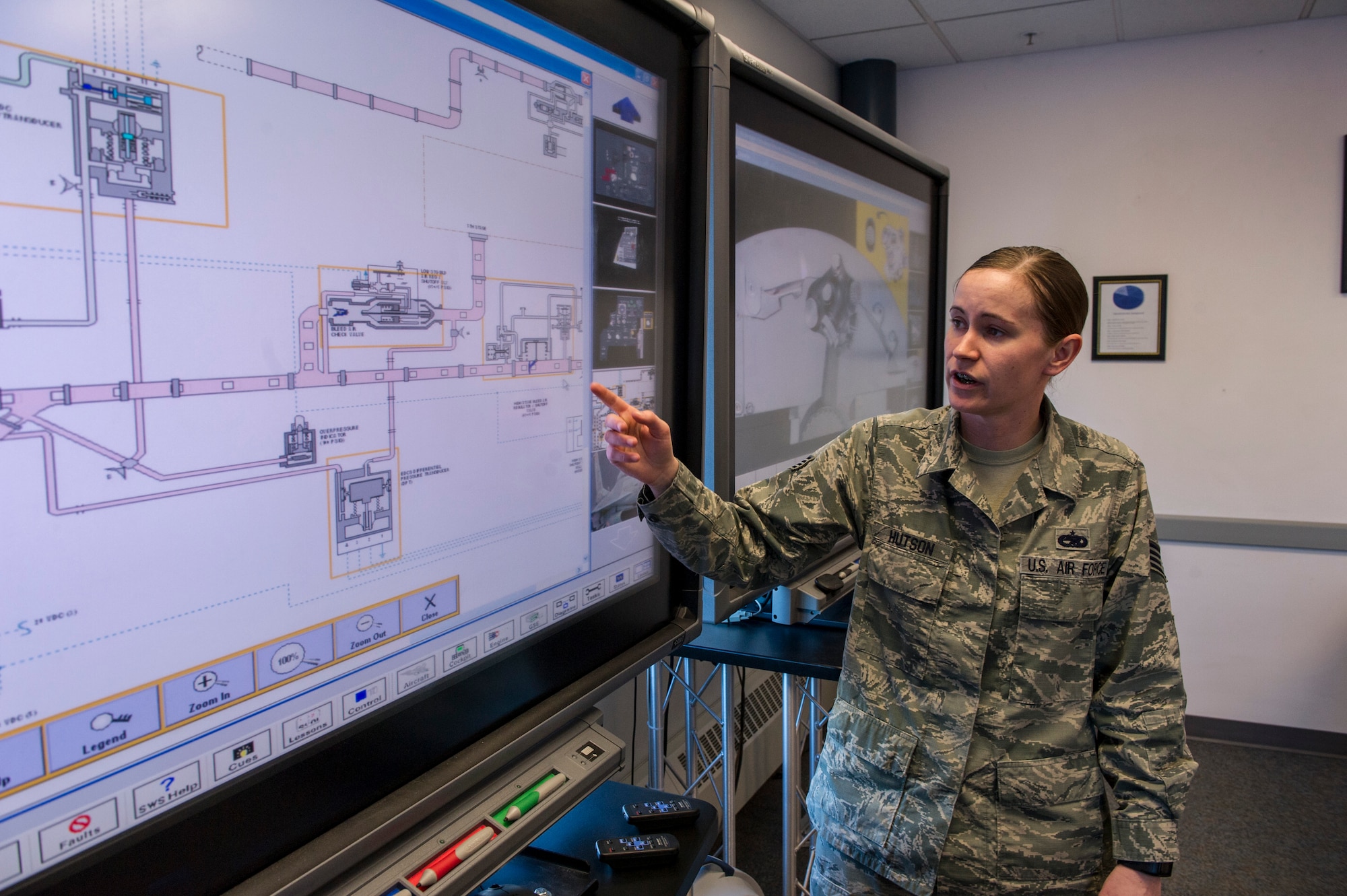Staff Sgt. Ashley Hutson, 372nd Training Squadron Detachment 25 electrical and environment instructor, demonstrates using the Modular Simulated Aircraft Maintenance Trainer March 7, 2014, Eielson Air Force Base, Alaska. The MSAMT allows students to get hands-on aircraft training without using an actual aircraft. (U.S. Air Force photo by Senior Airman Joshua Turner/Released)