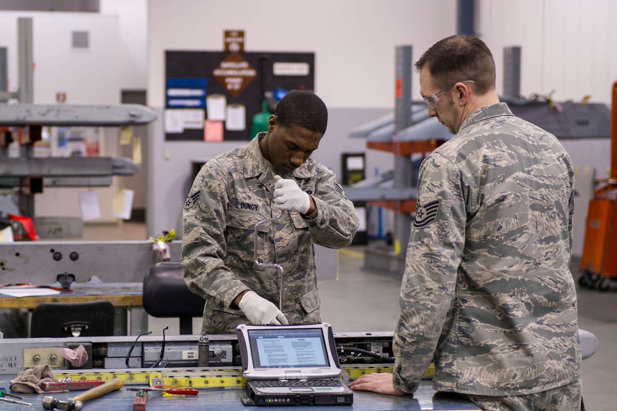 Tech. Sgt. Dustin Marr, 372nd Training Squadron Detachment 25 weapons instructor, instructs Senior Airman Kamryn Dungy, 354th Maintenance Squadron weapons loader,  on LAU-129 missile launcher procedures during an F-16 Fighting Falcon armament maintenance course March 7, 2014, Eielson Air Force Base, Alaska. Last year, Det. 25 instructors taught over 49 different courses of advanced aircraft technical training. (U.S. Air Force photo by Senior Airman Joshua Turner/Released)