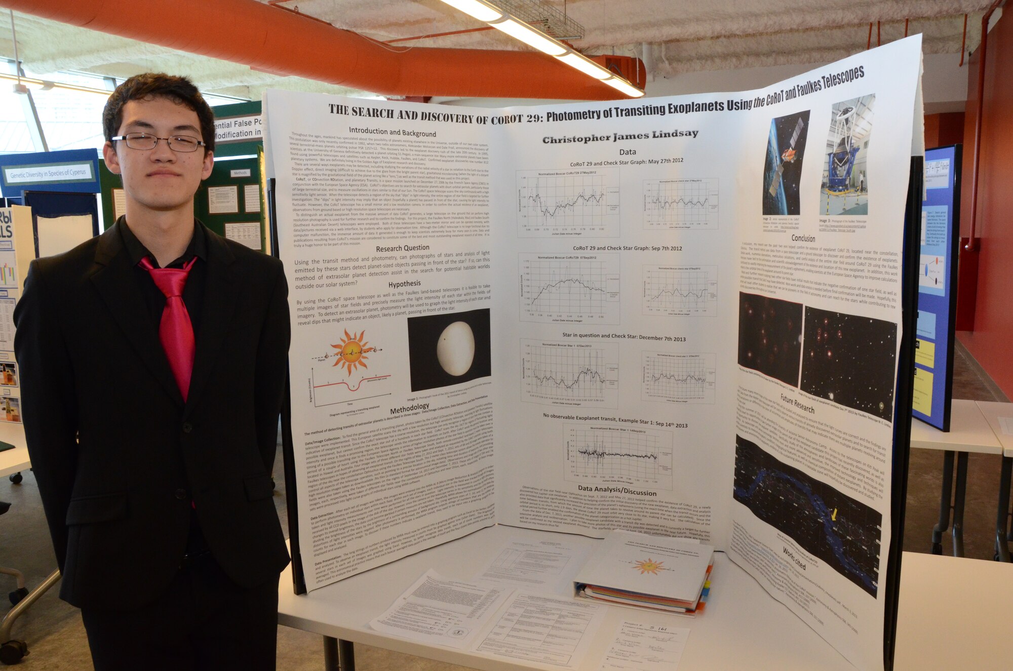 Christopher, student at Iolani School, Honolulu, Hawaii, poses for a photo next to his research project at the Hawaii Association of Independent Schools (HAIS) District Science & Engineering Fair held at Ioloni School, Honolulu, Hawaii, Feb. 8, 2014. Lt. Col. Nathan Kwon (not pictured), a Critical Care Air Transport Team (CCATT) physician with the 624th Aeromedical Staging Squadron, Joint Base Pearl Harbor-Hickam, Hawaii, served as a judge at the fair to support and encourage achievements of Hawaii's youth in science, technology, engineering, math, and medicine (STEMM), giving students the opportunity to hone their presentation skills by interacting with STEMM professionals. Christopher not only advanced to the state fair, but was one of two students selected to attend the Intel International Science and Engineering Fair (Intel ISEF) in Los Angeles, Calif., in May—the world’s largest international pre-college science competition. (U.S. Air Force photo by Tech. Sgt. Phyllis Keith)