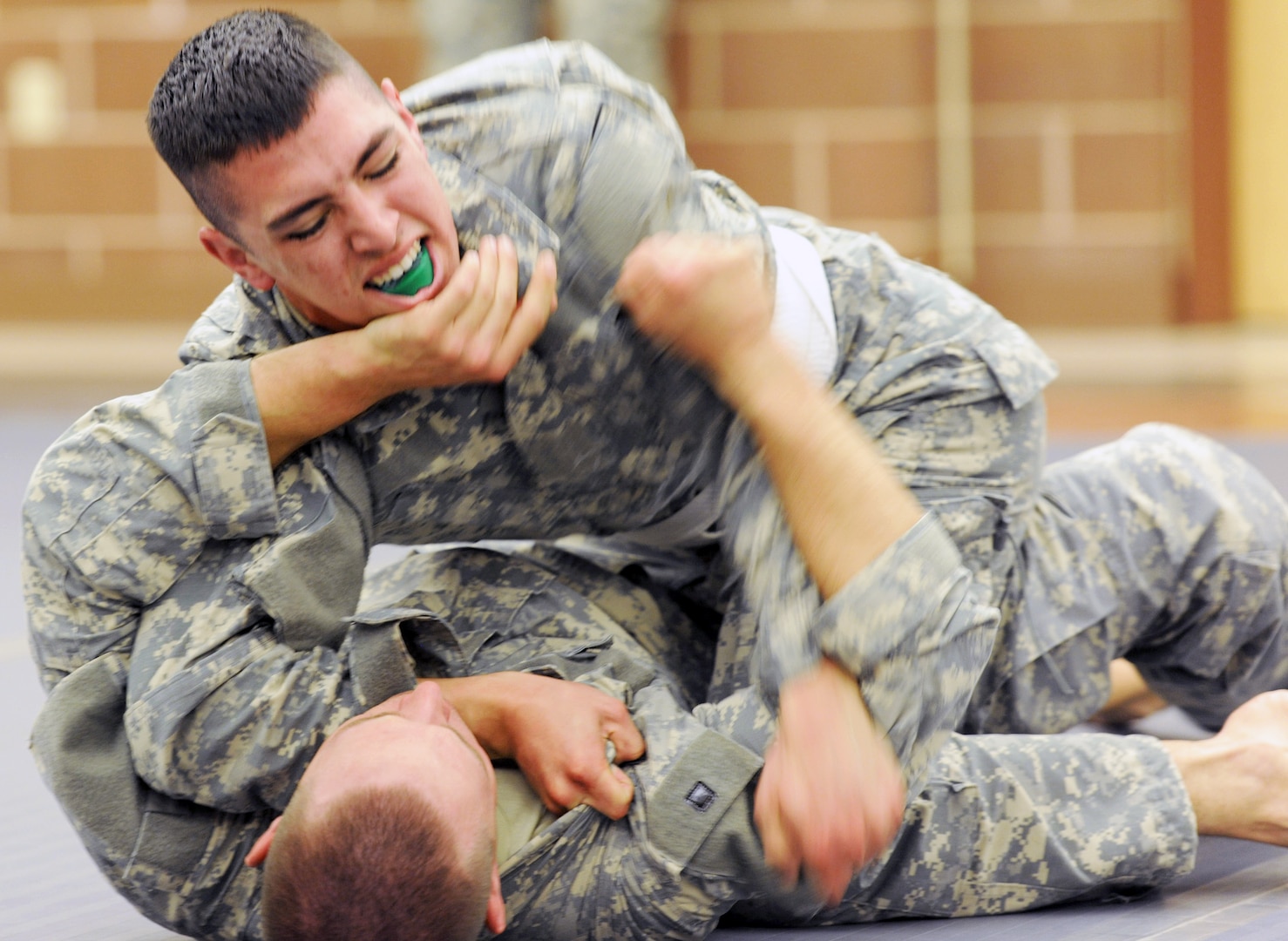 Spc. Christopher Ruff (top), with the 319th Combat Sustainment Support Battalion, Headquarters and Headquarters Detachment in Miami, Okla., competes in the Army combatives event during the 4th Sustainment Command (Expeditionary) Best Warrior Competition at March 6-8 Joint Base San Antonio-Camp Bullis.
Photo by Master Sgt. Robert R. Ramon