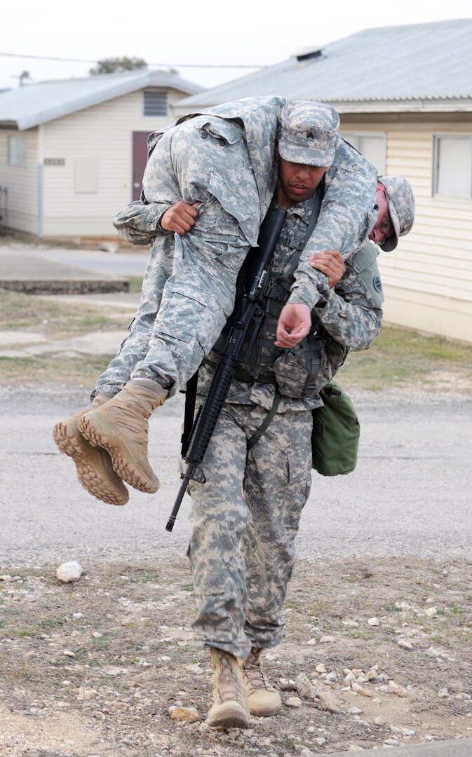 Sgt. Damian Robinson, with the 356th Transportation Company in Las Cruces, N.M., conducts a one-man carry during the 4th Sustainment Command (Expeditionary) Best Warrior Competition at March 6-8 Joint Base San Antonio-Camp Bullis.
Photo by Master Sgt. Robert R. Ramon