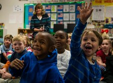 Children from St. Andrews Elementary School ask Airmen from Joint Base Charleston, S.C., questions about the military during a Dr. Seuss reading session March 7, 2014. More than 30 Airmen from JB Charleston attended the annual reading event, ate breakfast with the children, answered questions about the Air Force and then read the children’s favorite Dr. Seuss book. (U.S. Air Force photo/ Senior Airman Dennis Sloan)