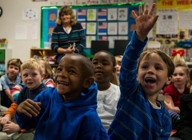 Children from St. Andrews Elementary School ask Airmen from Joint Base Charleston, S.C., questions about the military during a Dr. Seuss reading session March 7, 2014. More than 30 Airmen from JB Charleston attended the annual reading event, ate breakfast with the children, answered questions about the Air Force and then read the children’s favorite Dr. Seuss book. (U.S. Air Force photo/ Senior Airman Dennis Sloan)