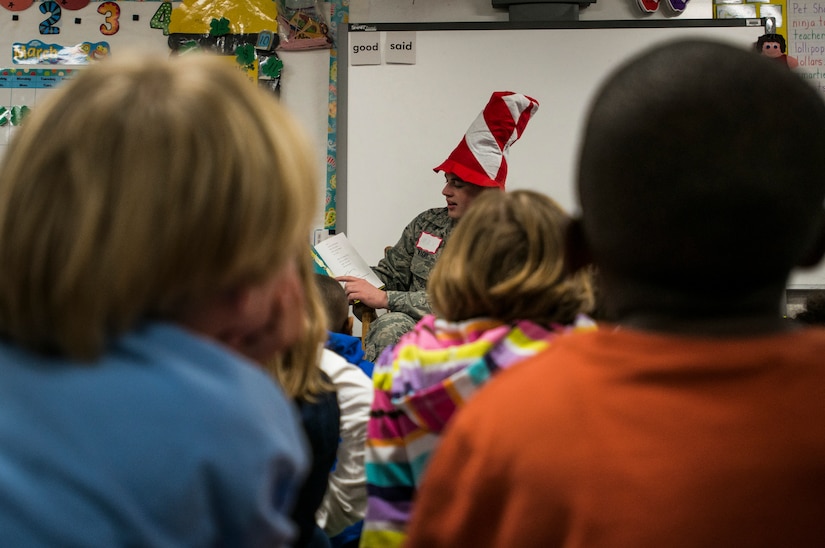 Airman 1st Class Max Wanzy, 628th Contracting Squadron specialist, reads a Dr. Seuss book to children at St. Andrews Elementary School March 7, 2014. More than 30 Airmen from JB Charleston attended the annual reading event, ate breakfast with the children, answered questions about the Air Force and then read the children’s favorite Dr. Seuss book. (U.S. Air Force photo/ Senior Airman Dennis Sloan)