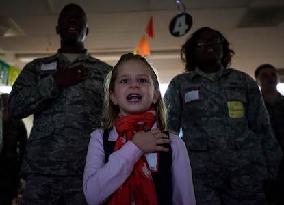 Piper Soliyan, a St. Andrews Elementary School kindergarten student, says the Pledge of Allegiance with Airmen from Joint Base Charleston, S.C., before Airmen read to the children March 7, 2014. More than 30 Airmen from JB Charleston attended the annual reading event, ate breakfast with the children, answered questions about the Air Force and then read the children’s favorite Dr. Seuss book. (U.S. Air Force photo/ Senior Airman Dennis Sloan)