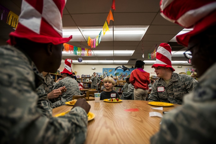 Hoyt Darden, a St. Andrews Elementary School kindergarten student, eats breakfast with a group of Airmen from Joint Base Charleston, S.C., before the Airmen read their favorite Dr. Seuss books to the students March 7, 2014. More than 30 Airmen from JB Charleston attended the event, ate breakfast with the children and answered questions about the Air Force. (U.S. Air Force photo/ Senior Airman Dennis Sloan)