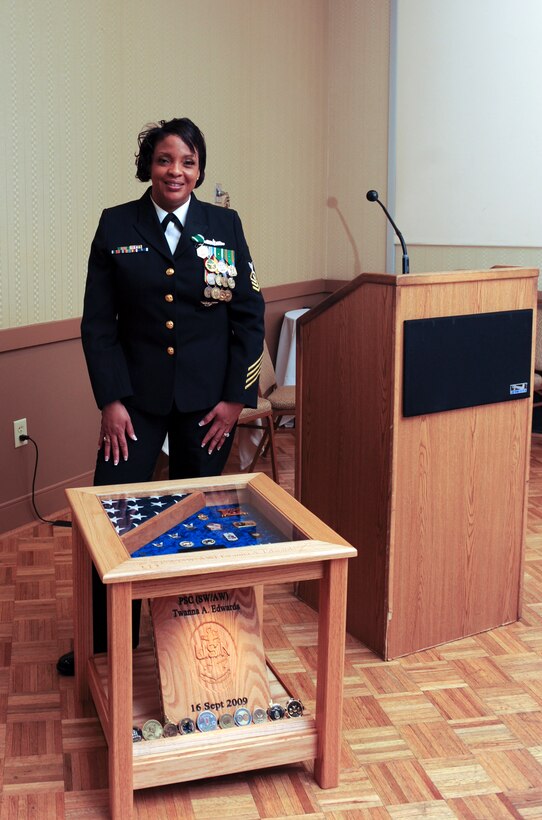 U.S. Navy Chief Petty Officer Twanna Edwards retires after 20 years in the Navy March 7, 2014, at Naval Station Norfolk, Va. Edwards served 17 years as a personnel specialist and three years as a substance abuse counselor. Edwards said the Navy exceeded all her expectations and she was thankful for the opportunity to experience an amazing career.  (U.S. Air Force photo by Airman 1st Class Kedesha Pennant/Released)
