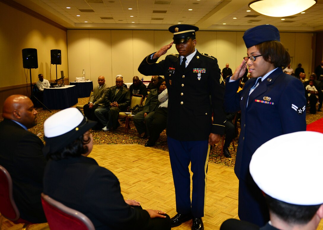 U. S. Army Sgt. Brandon Burke, left, and U.S. Air Force Airman 1st Class Kedesha Pennant render a salute to U.S. Navy Chief Petty Officer Twanna Edwards during Edwards’ retirement ceremony, as a part of a Navy tradition March 7, 2014, at Naval Station Norfolk, Va. In the ceremony, Burke and Pennant represented two of the five ranks Edwards held during her career. (U.S. Navy Photo by Mass Communication Specialist 3rd Class Amber O'Donovan/Released)

