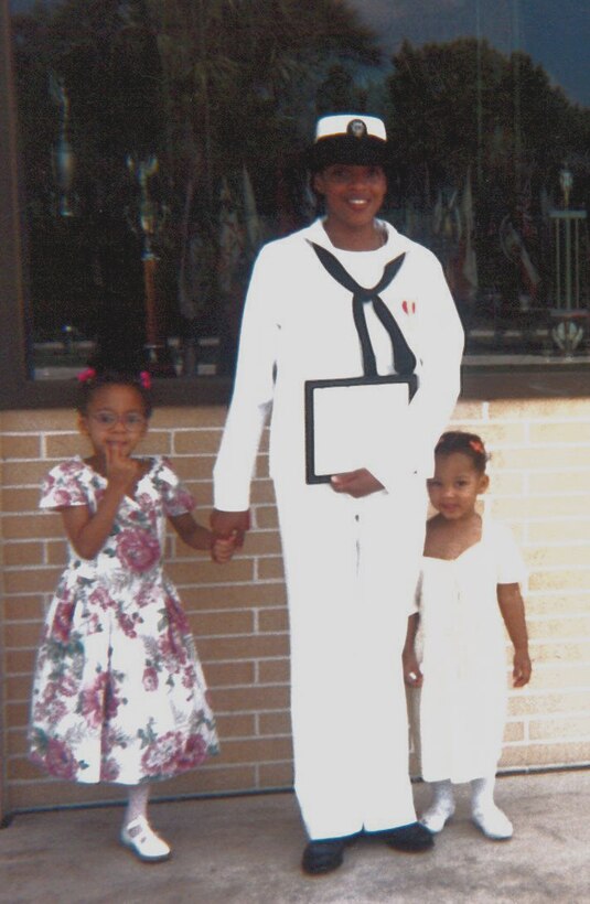 U.S. Navy Seaman Twanna Burke captures a moment with her daughter, Kedesha Pennant, left, and niece, Kim Huggins, after her recruit training graduation May 2, 1994, at U.S. Navy Recruit Training Command Orlando, Fla. Burke joined the Navy to escape her adversity and provide a better life for herself and her daughter. (Courtesy photo)