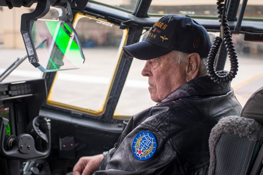 Former U.S. Air Force 1st Lt. Ken Taylor, World War II B-29 bombardier, listens during a demonstration aboard an HC-130J Combat King II at Moody Air Force Base, Ga., March 7, 2014.  Taylor flew 30 missions over Japan between April and August of 1945, earning a Distinguished Flying Cross and flying the last combat mission during WWII. (U.S. Air Force photo by Airman 1st Class Ryan Callaghan/Released)