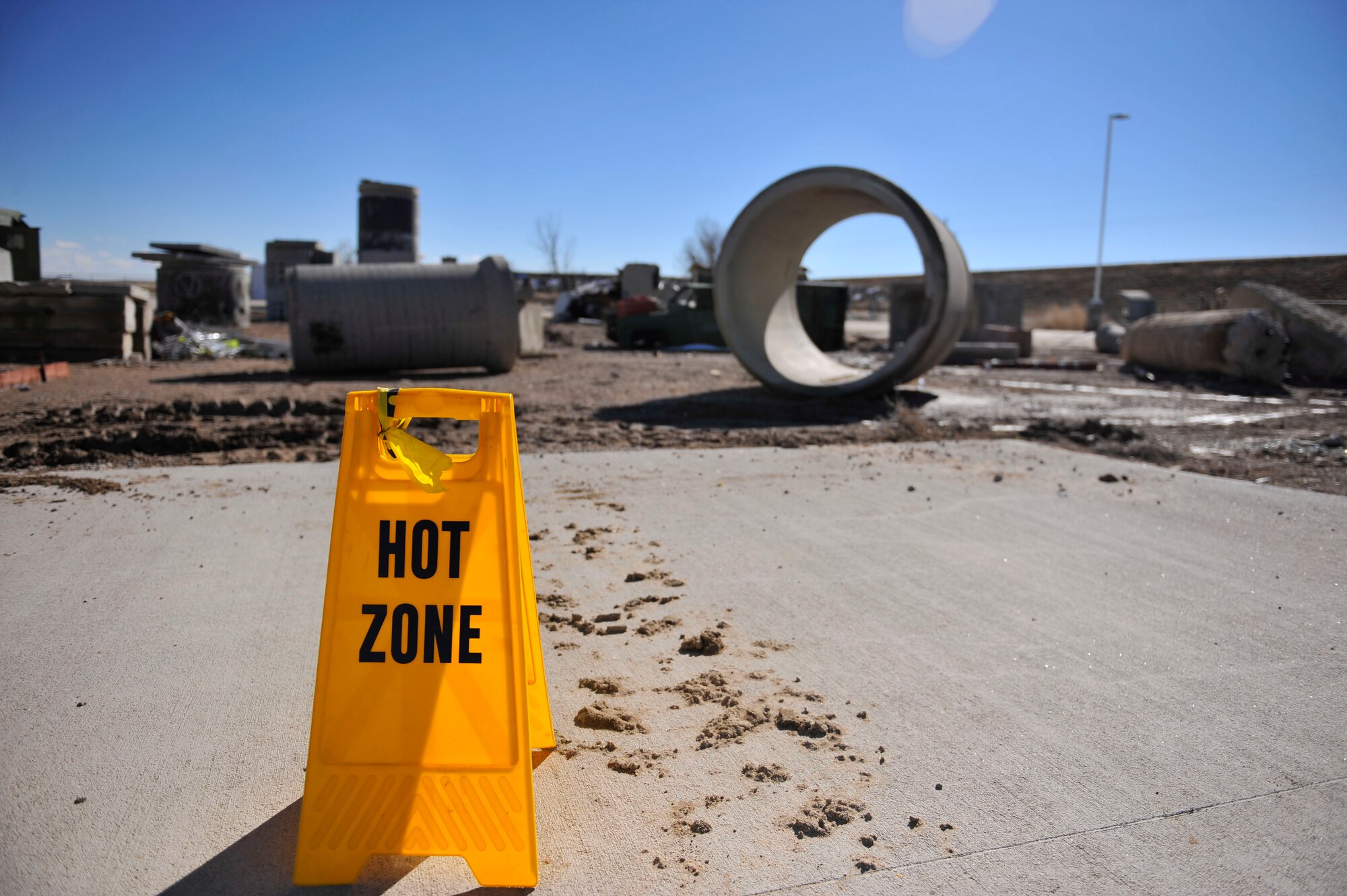 A sign depicts a large area of rubble, known as the “hot zone”, where Colorado National Guard Chemical, Biological, Radiological, Nuclear and High-Yield Explosive Enhanced Response Force Package members practice an emergency exercise March 8, 2014, in Lakewood, Colo. The CERFP team spends one weekend every three months training in an emergency exercise to refine their skills in search and rescue, decontamination and medical procedures. (U.S Air Force photo by Airman 1st Class Samantha Saulsbury/Released)