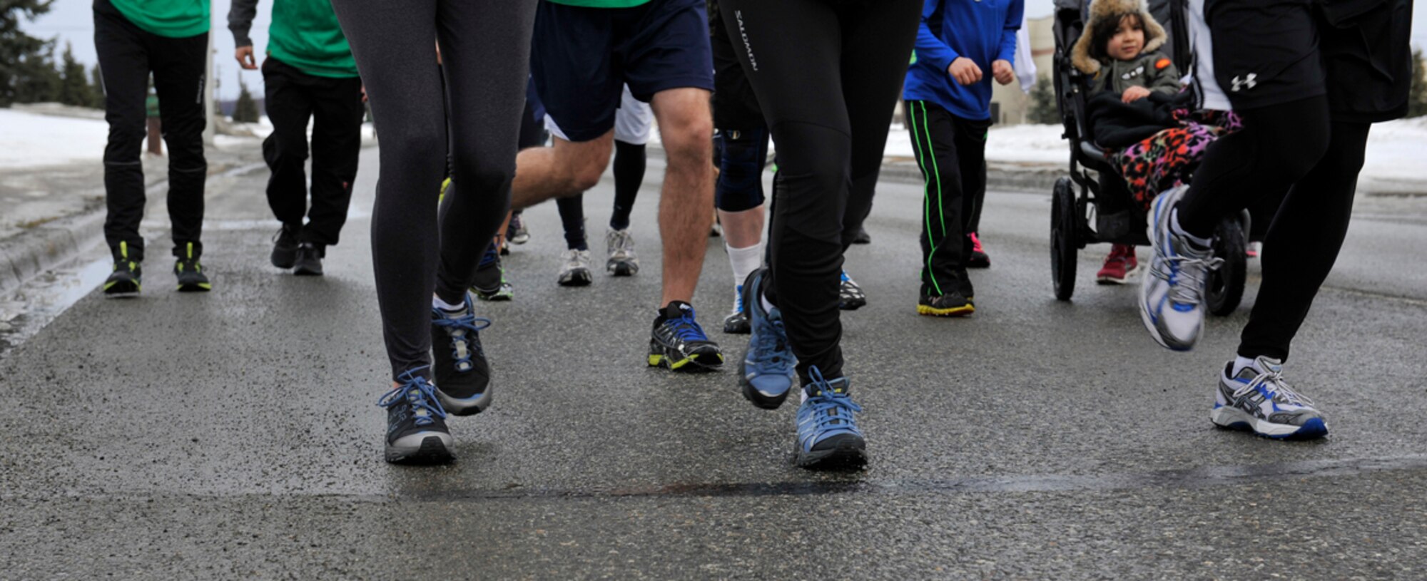 Participants run on Joint Base Elmendorf-Richardson, Alaska, during the first St. Paddy’s Day Fun Run, March 14. More than 20 military members and their families participated in the run. St. Patrick’s Day recognizes the patron saint of Ireland, Saint Patrick. Traditionally, celebrants wear the color green or feature shamrocks to signify the Christian holy Trinity, revered in Irish culture. (U.S. Air Force photo/Airman 1st Class Tammie Ramsouer)