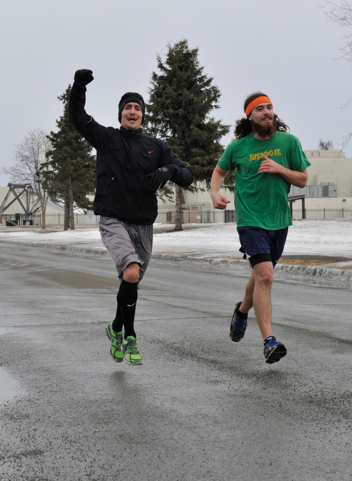 John Limon, 673d Force Support Squadron Health and Wellness Center exercise physiologist; and Alex Flores, 673d FSS lifeguard, run during the St. Paddy’s Day Fun Run on Joint Base Elmendorf-Richardson, Alaska, March 14. More than 20 military members and their families participated in the run. (U.S. Air Force photo/Airman 1st Class Tammie Ramsouer)