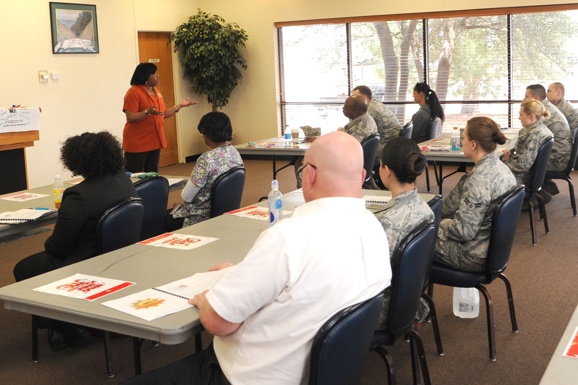 ALTUS AIR FORCE BASE, Okla. – Suzette Betsill, 97th Force Support Squadron deputy director-in-training, speaks to Altus Airmen about positively addressing customers in the Freedom Community Center March 18, 2014. The customer service training was conducted to teach Airmen techniques to communicate positively and professionally with customers. (U.S. Air Force photo by Airman 1st Class J. Zuriel Lee/Released)