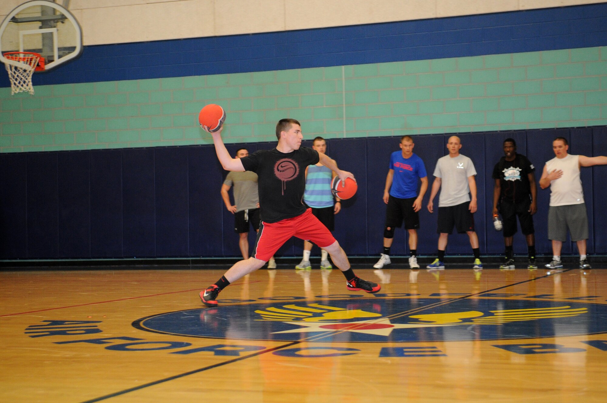 GOODFELLOW AIR FORCE BASE, Texas -- Airman 1st Class Austin Debban, 316th Training Squadron student, prepares to throw the ball during the Sexual Assault Prevention and Response dodgeball tournament here March 1. The tournament raised awareness of the SAPR program. (U.S. Air Force photo/ Staff Sgt. Laura R. McFarlane) 