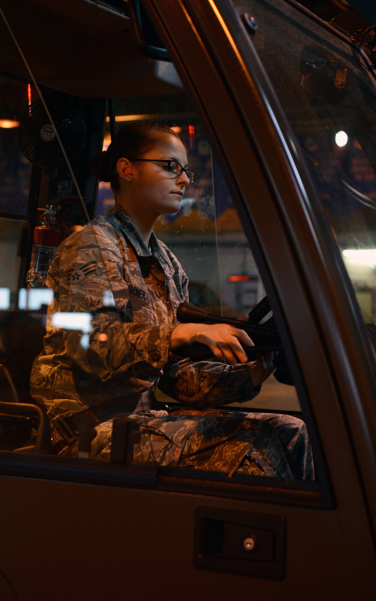 U.S. Air Force Senior Airman Felicia Zimmer, 727th Air Mobility Squadron air freight technician from Nashville, Tenn., operates a fork lift March 10, 2014, on RAF Mildenhall, England. Zimmer earned the Square D Spotlight for exhibiting the Air Force Core Value of Integrity First. (U.S. Air Force photo by Airman 1st Class Kyla Gifford/Released)