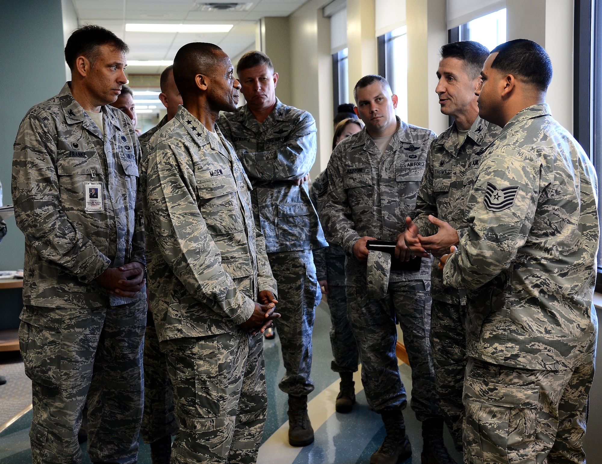 Lt. Gen. Darren McDew, 18th Air Force commander, visits with Airmen from the 6th Medical Group at MacDill Air Force Base, Fla., March 11, 2014. McDew toured multiple sections of the MacDill clinic. (U.S. Air Force photo by Airman 1st Class Tori Schultz/Released)