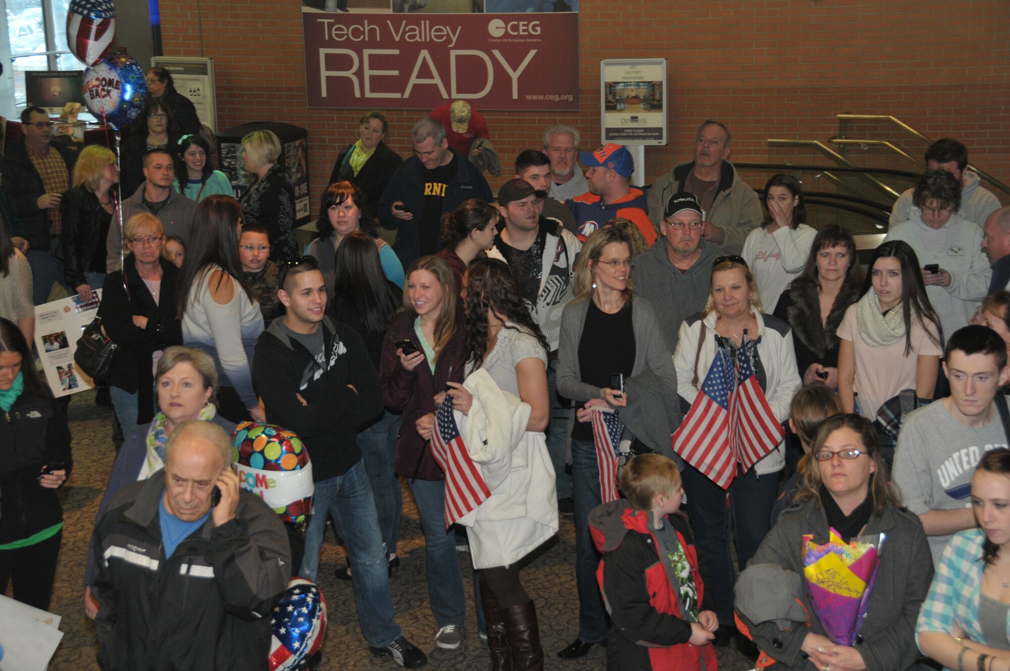 ALBANY, N.Y. -- Family and friends eagerly await the arrival of their loved ones March 15, 2014, who had been deplolyed to Bagram Air Base, Afghanistan, for the last six months. The returning Airmen are assigned to the 109th Small Air Terminal at nearby Stratton Air National Guard Base. (Air National Guard photo by Tech. Sgt. Catharine Schmidt/Released)