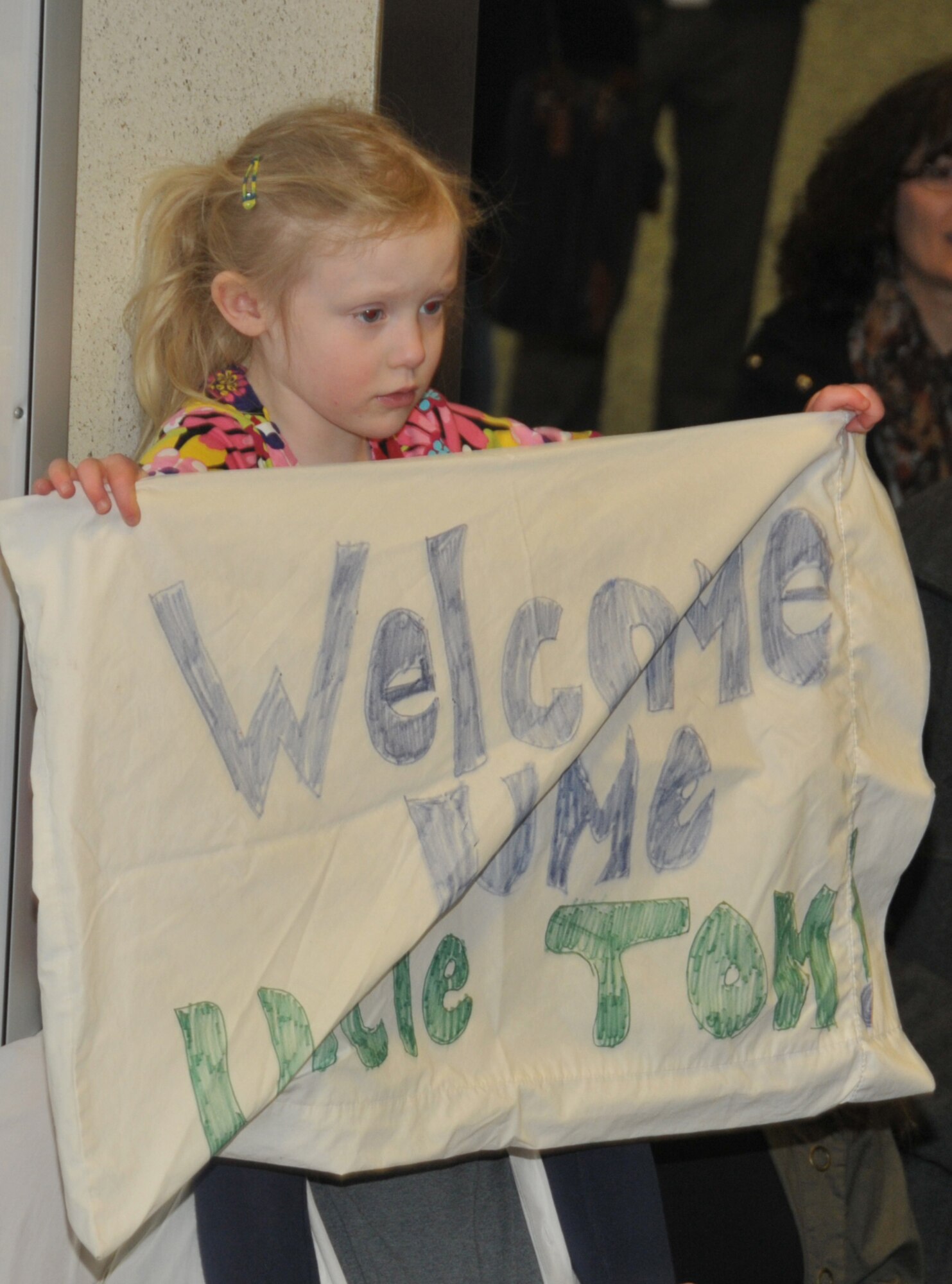 ALBANY, N.Y. -- A young girl prepares to welcome home her uncle, Tech. Sgt. Thomas Houck, from a six-month deployment in Afghanistan on March 15, 2014. Houck was among about 15 109th Small Air Terminal who were deployed to Bagram Air Base. (Air National Guard photo by Tech. Sgt. Catharine Schmidt/Released)