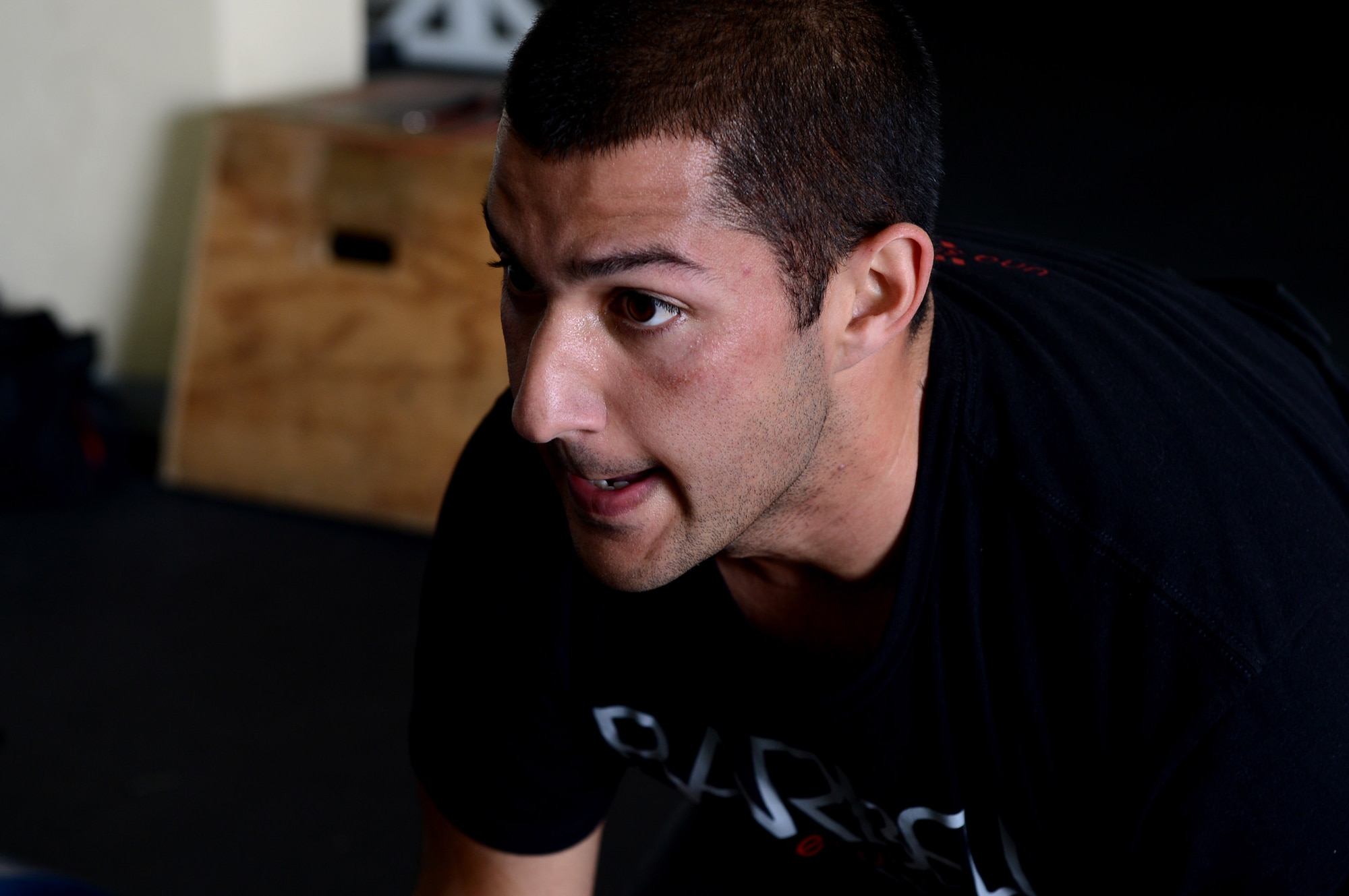 U.S. Air Force Senior Airman Anthony Pelaez, 52nd Component Maintenance Squadron jet engine mechanic from Miami, rests between workout repetitions at Spangdahlem Air Base, Germany, March 14, 2014. Participating in sports is a good way of maintaining comprehensive Airmen fitness. (U.S. Air Force photo by Airman 1st Class/Released)