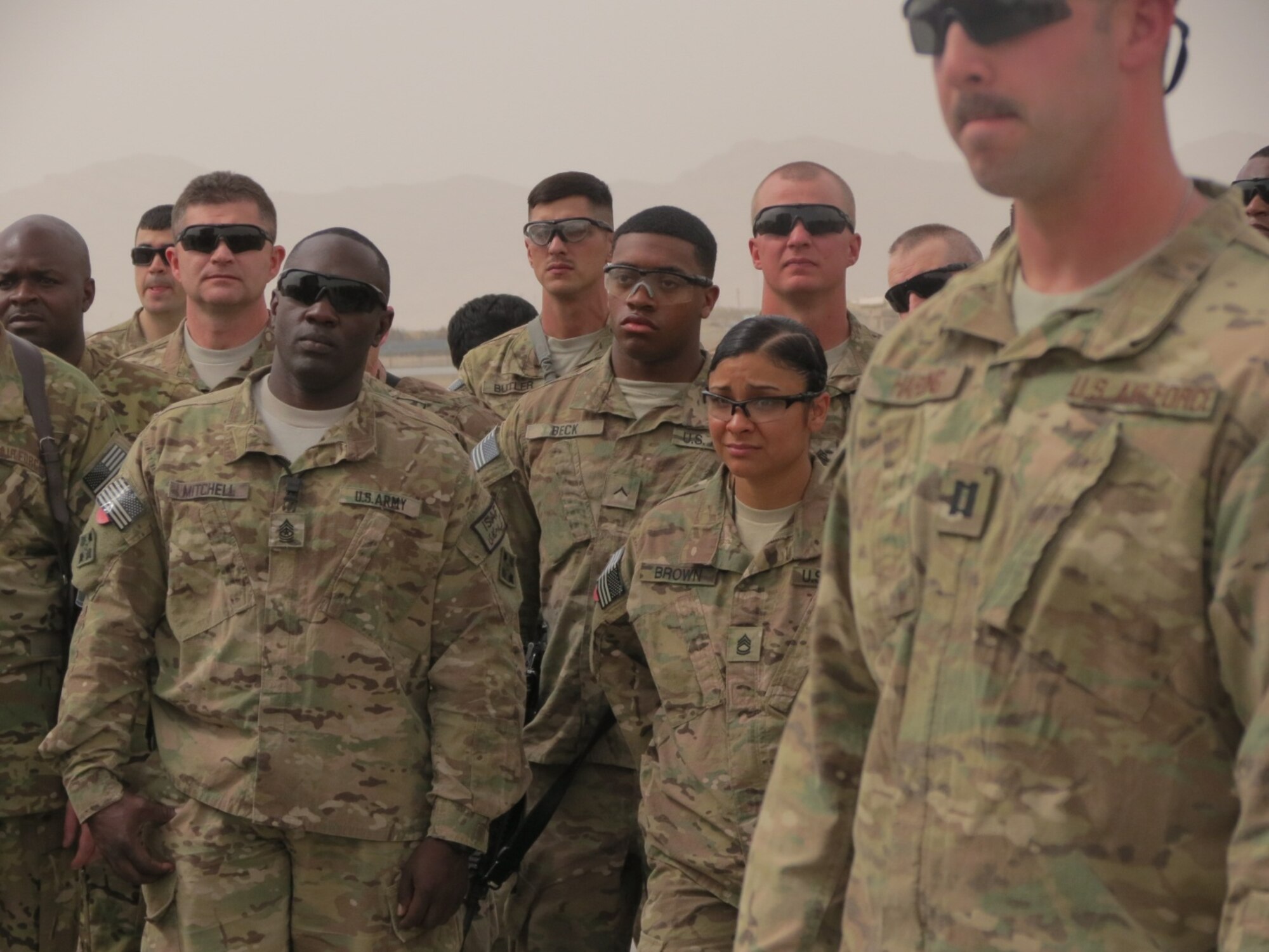Fellow Service men and women stand proudly as they greet five wounded warriors returning to theater during the fifth edition of Operation Proper Exit at Kandahar Airfield, Afghanistan, March 13, 2014. The operation left Service members with a sense of pride, honor and brotherhood in the deployed location. The warriors visited different Forward Operating Bases throughout Afghanistan telling their stories and providing courage to those who still fight for freedom. (U.S. Air Force photo by Senior Airman Alexandria Bandin/Released)