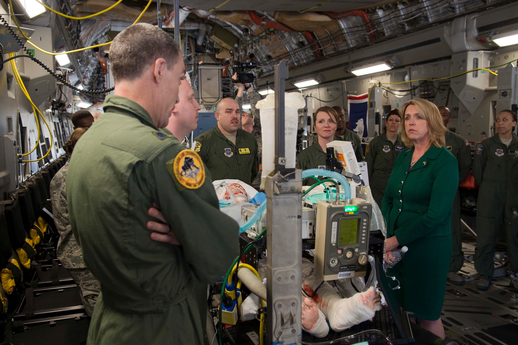 Secretary of the Air Force Deborah Lee James, during a visit March 17, 2014 to Ramstein Air Base, Germany, discusses with Lt. Col. Peter Crawley, 10th Expeditionary Aeromedical Evacuation Flight physician, how they are able to perform medical evacuations from around the world. During James' first visit to Europe as the SecAF, she visited with Airmen in their workplaces and received briefings on Ramstein’s many missions. (U.S. Air Force photo/Senior Airman Jose L. Leon)