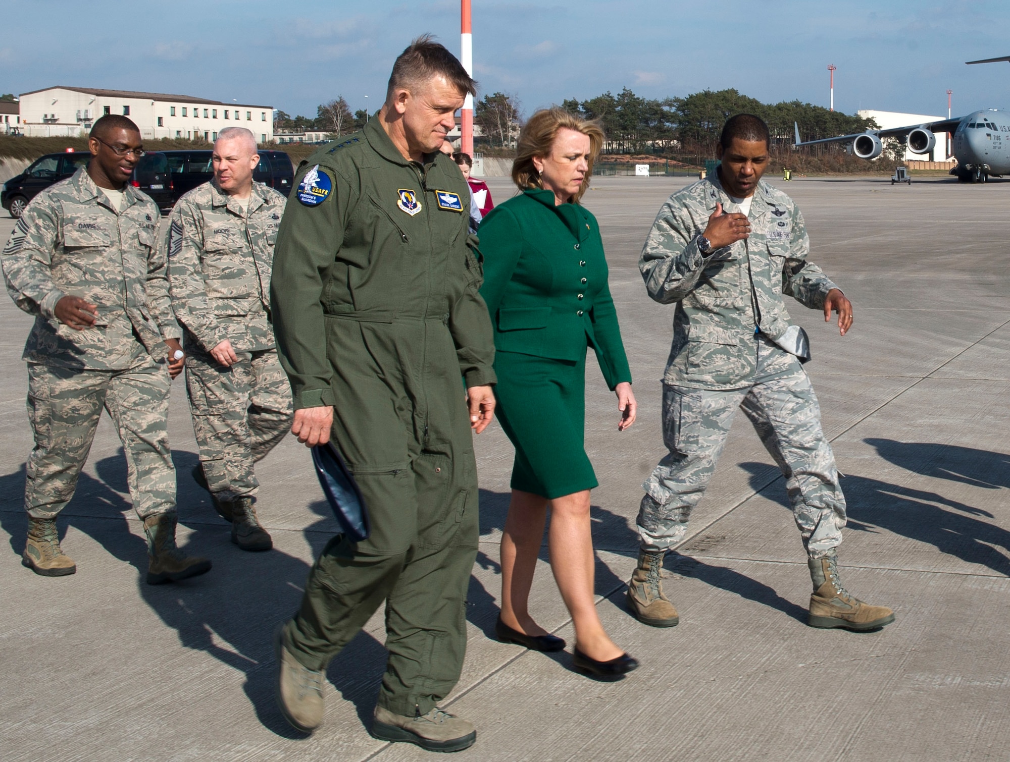 Secretary of the Air Force Deborah Lee James walks with Gen. Frank Gorenc, U.S. Air Forces in Europe and Air Forces Africa commander, and Col. Randall Reed, 521st Air Mobility Operations Wing commander, March 17, 2014 at Ramstein Air Base, Germany. During James' first visit to Europe as SecAF, she visited with Airmen in their workplaces and received briefings on Ramstein’s many missions. (U.S. Air Force photo/Senior Airman Jose L. Leon)