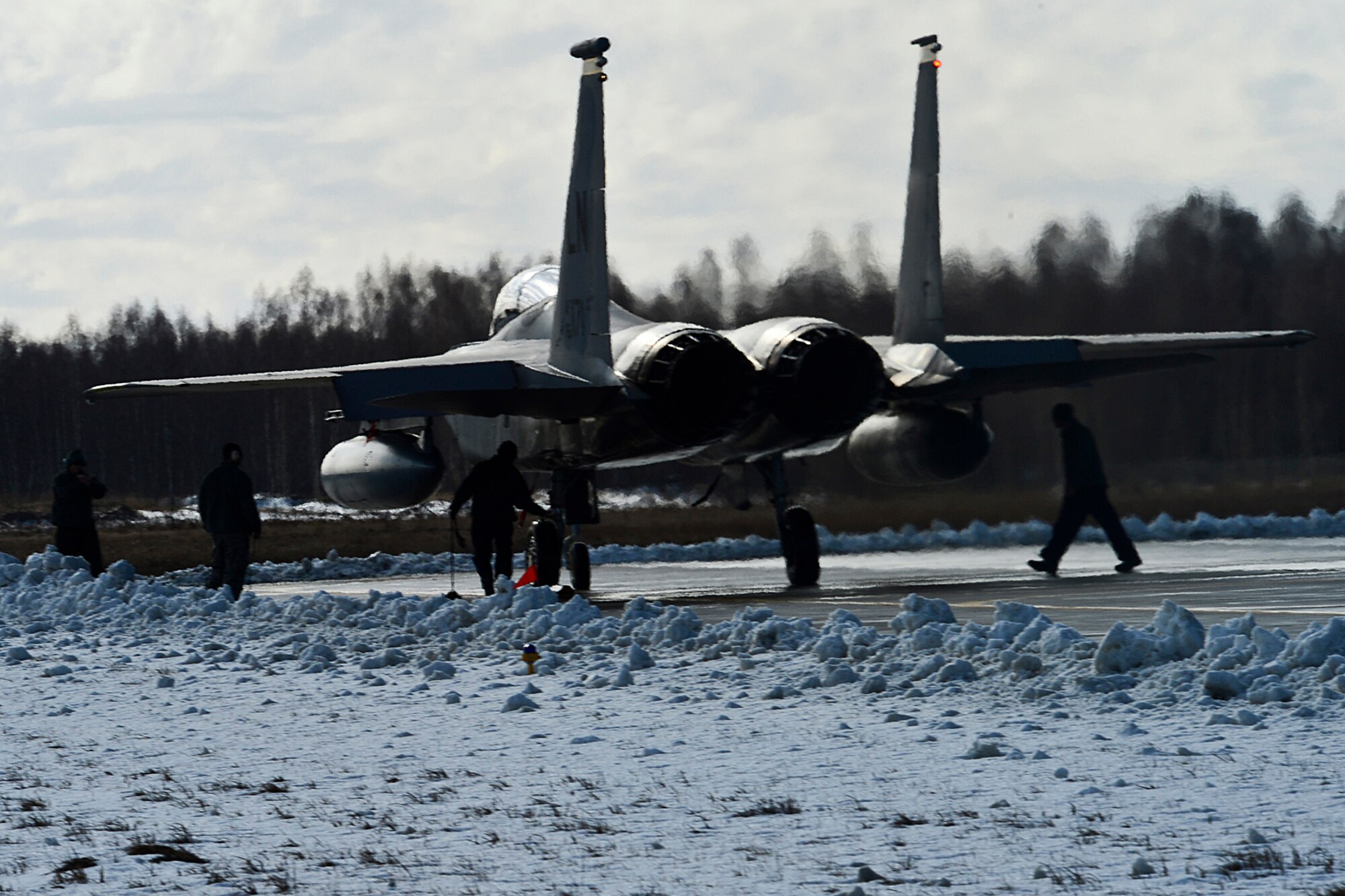 An F-15C Eagle taxis to the runway at Šiauliai Air Base, Lithuania, March 18, 2014.The 493rd Expeditionary Fighter Squadron regularly flies training missions while deployed to maintain readiness and proficiency. The U.S. Air Force F-15C Eagles' participation in the NATO Baltic Air Policing mission helps ensure a safe and stable future for the Baltics while preserving the integrity of NATO's borders and NATO security. (U.S. Air Force photo by Airman 1st Class Dana J. Butler)  