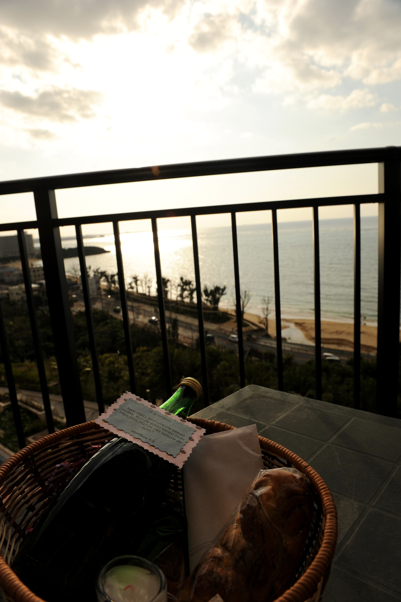 A gift basket with sparkling water, a candle, a rosary and bread sits on the balcony of the Kafuu Resort on Okinawa, Japan, March 15, 2014. Each couple participating in a three-day, two-night marriage retreat at the resort received a gift basket, and participated in discussions centered on couple’s communication and strengthening relationships within their marriage. (U.S. Air Force photo by Airman 1st Class Hailey R. Staker)